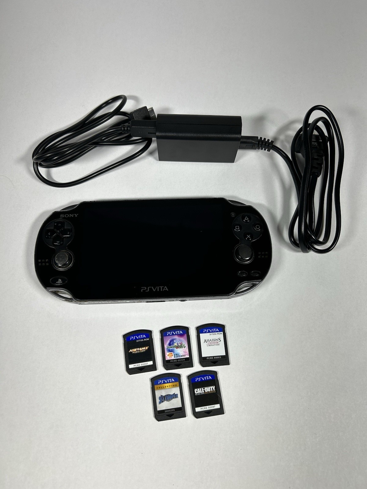 Sony PlayStation Vita PCH-1001 Black Handheld Console w/ Charger 5 Games Tested