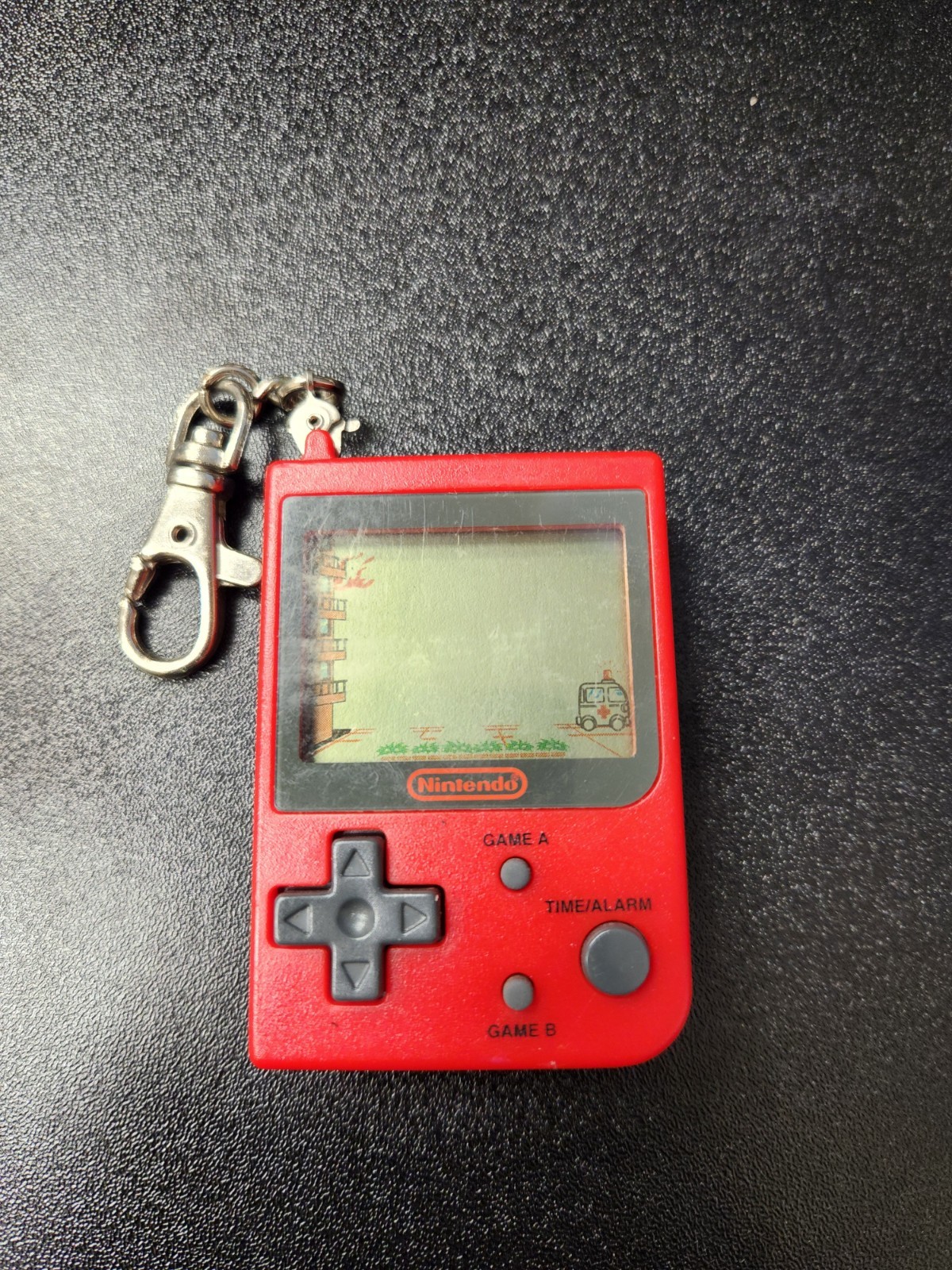 RARE 1998 Nintendo Mini Classic – Red Fire Keychain Game (Stadlbauer)