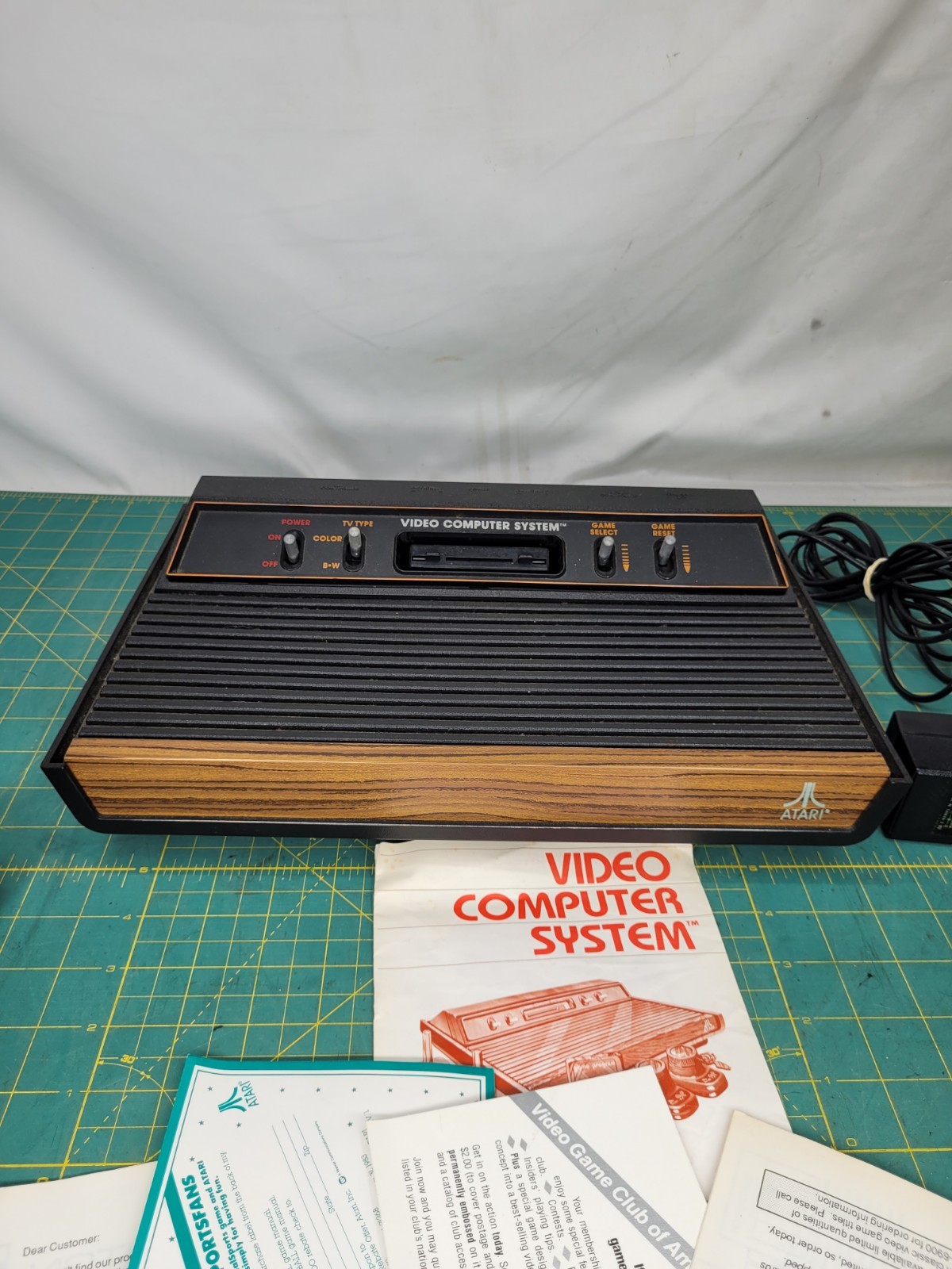Atari 2600 console With Cords And 4 Joystick Controllers Powers On Needs Work