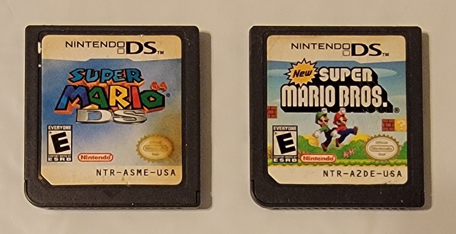 Nintendo DSi XL Bronze w/ Charger & 2 Games Mario 64 DS & New Super Mario Bros