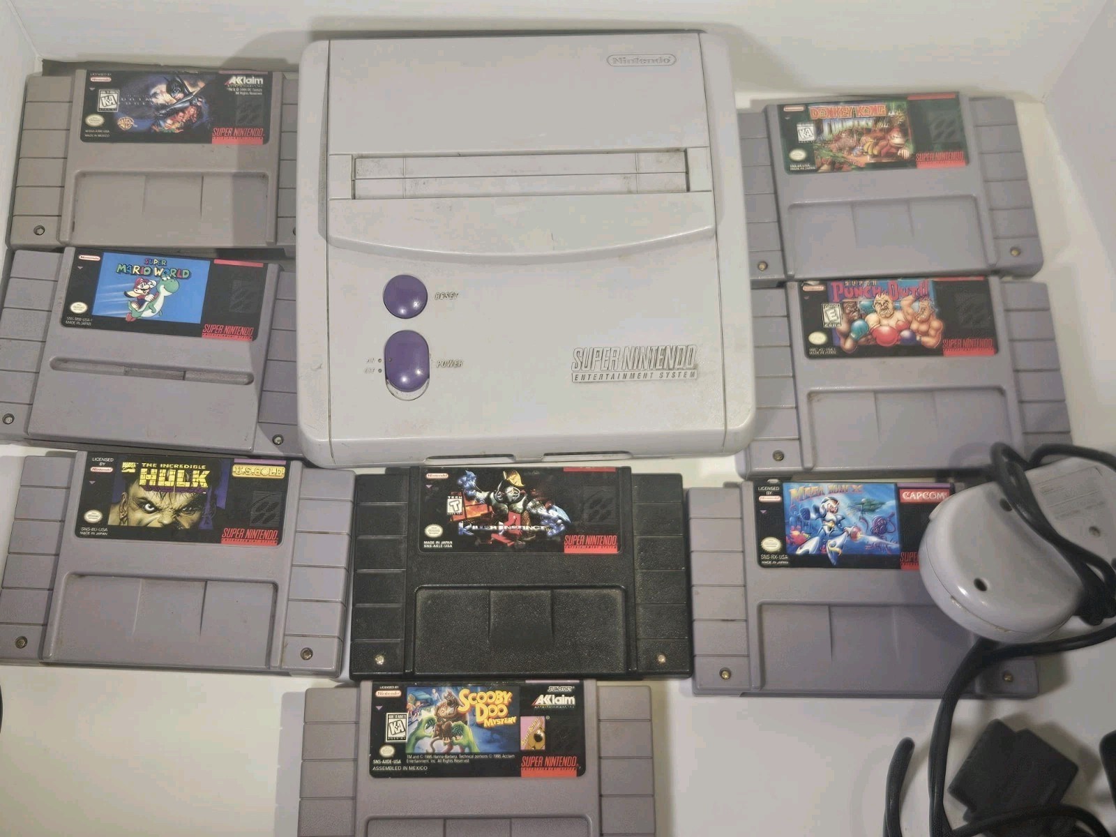 Super Nintendo SNES JR Console with 8 games, cords, and 1 controller