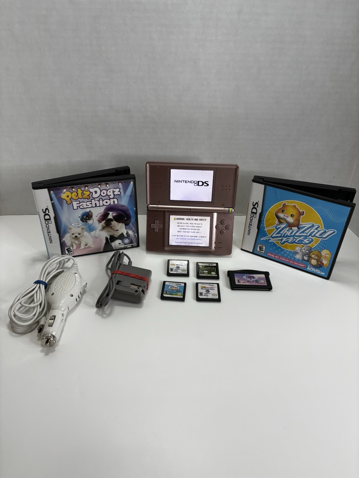 Nintendo DS Lite USG-001 Pink Handheld Console Bundle w/ 7 Games Charger Tested