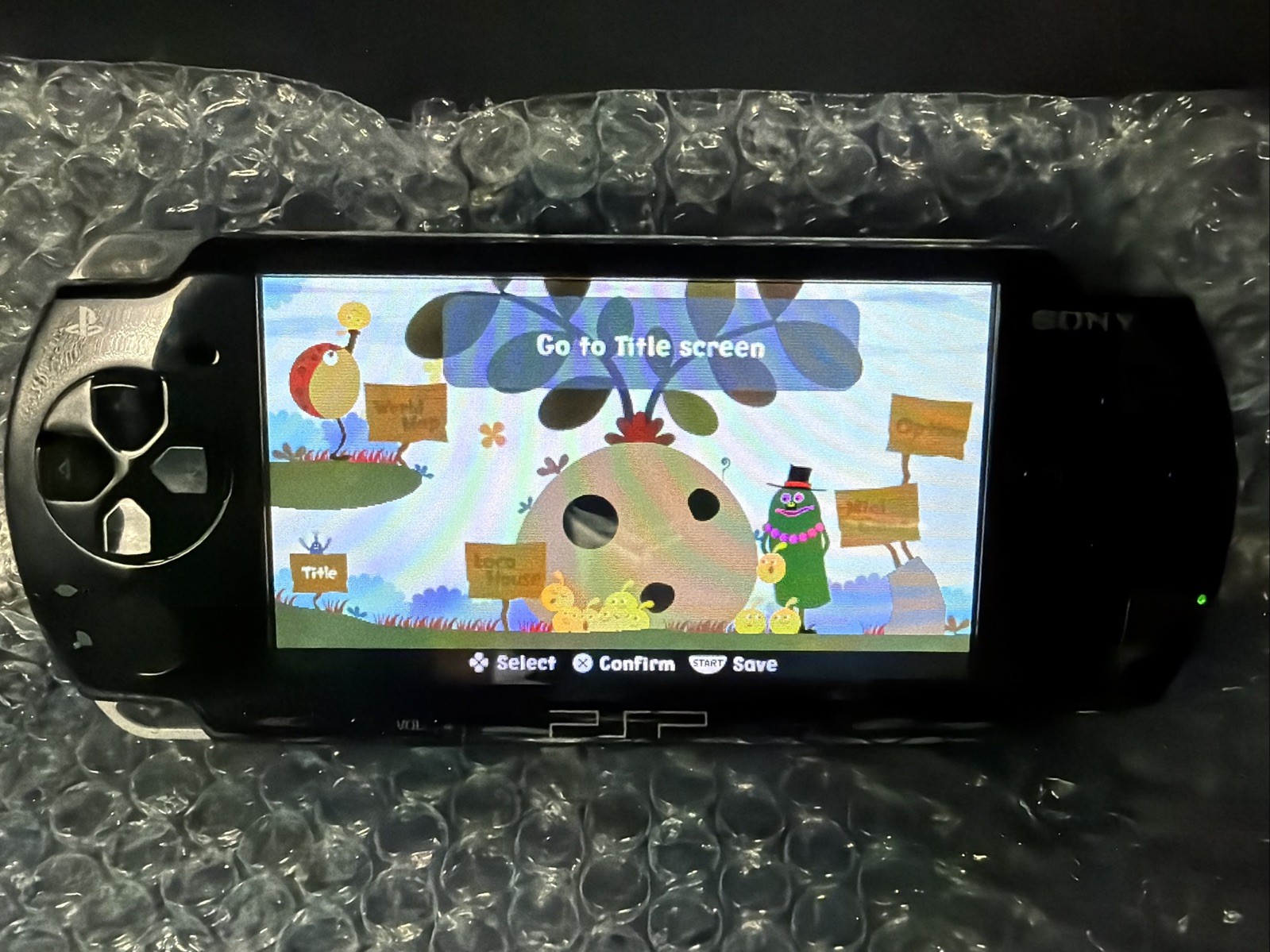 PSP 2001 Console W/Memory Stick 2GB AND CHARGER Working/ tested. W/ Loco Roco