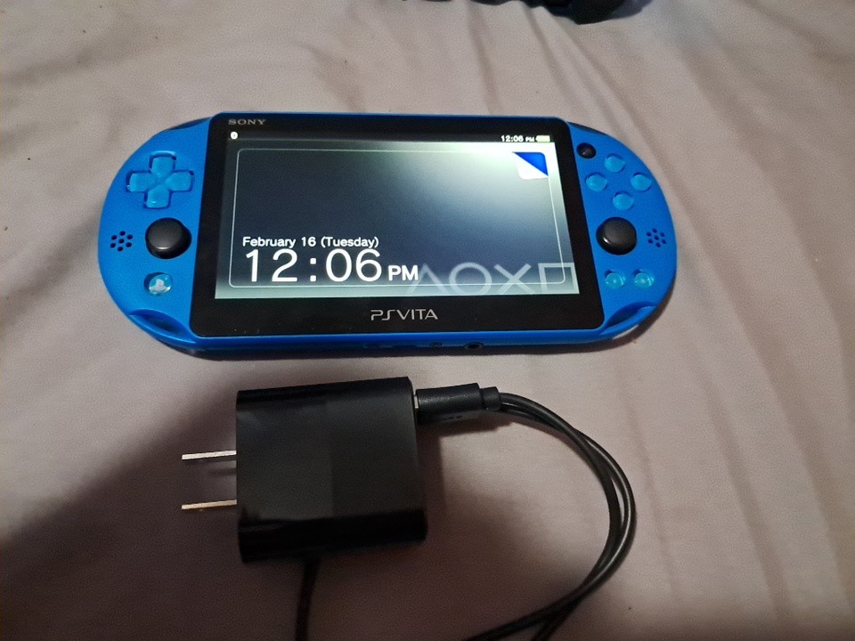 Sony PS Vita PCH-2000 Blue Handheld System Console Wi-Fi with charger and sd
