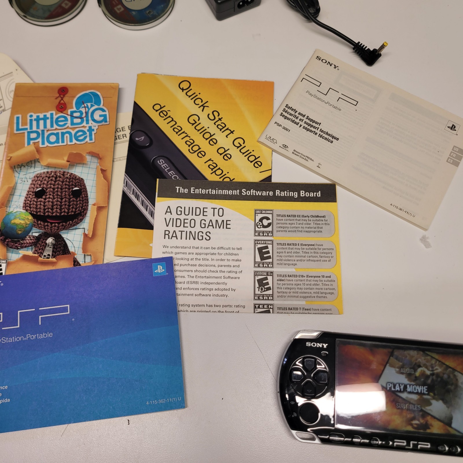 Sony PSP-3001 & PSP-1001 System Bundle W/ Storage, Game, DVD and Charger Read!