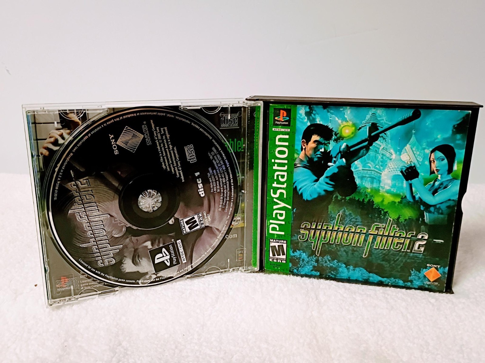 Playstation 1 with 1 controller, AV Cable, power cable and Syphon Filter 2 game