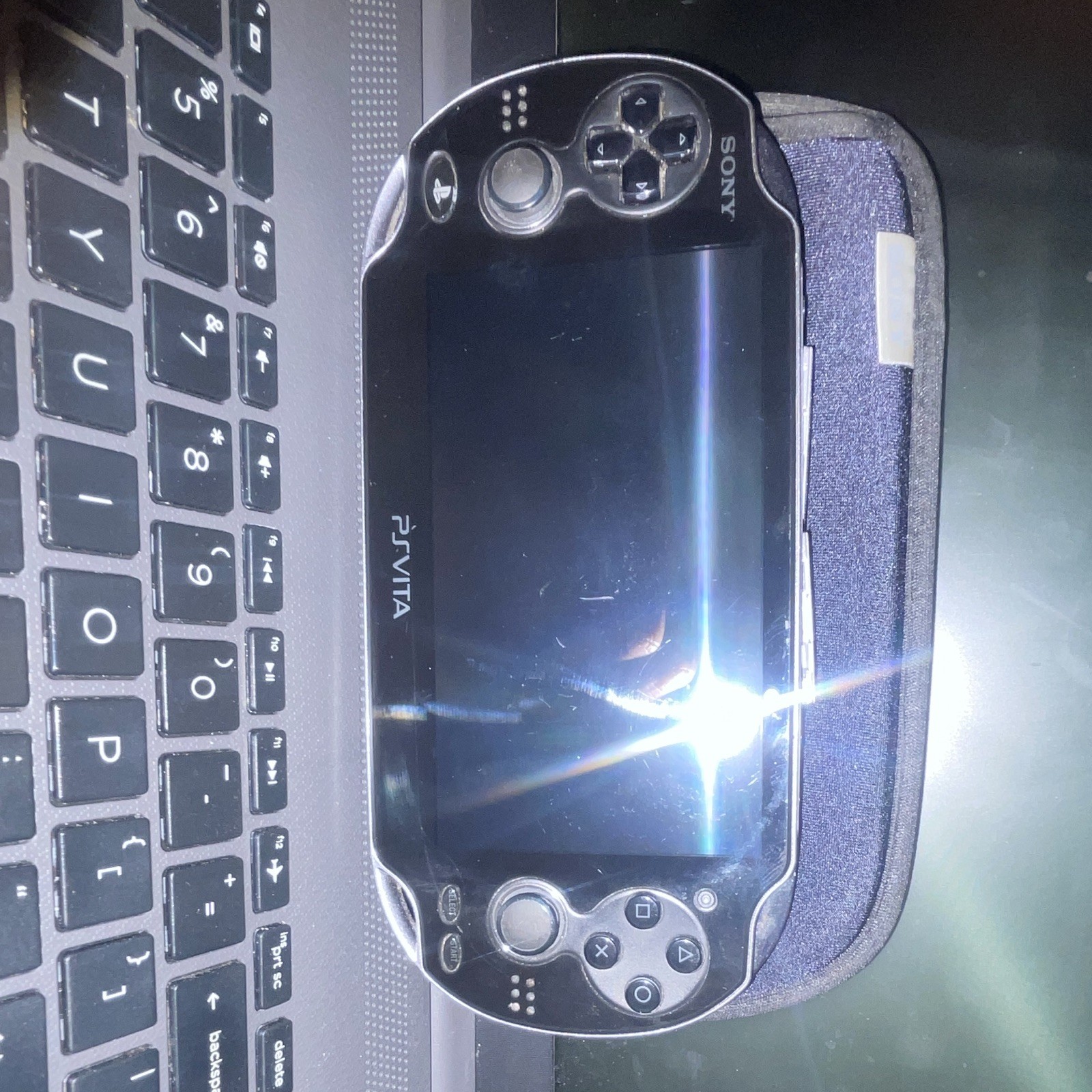 Sony PS Vita PCH-1001 Black Handheld System w/ 4GB Memory Card (no charger)