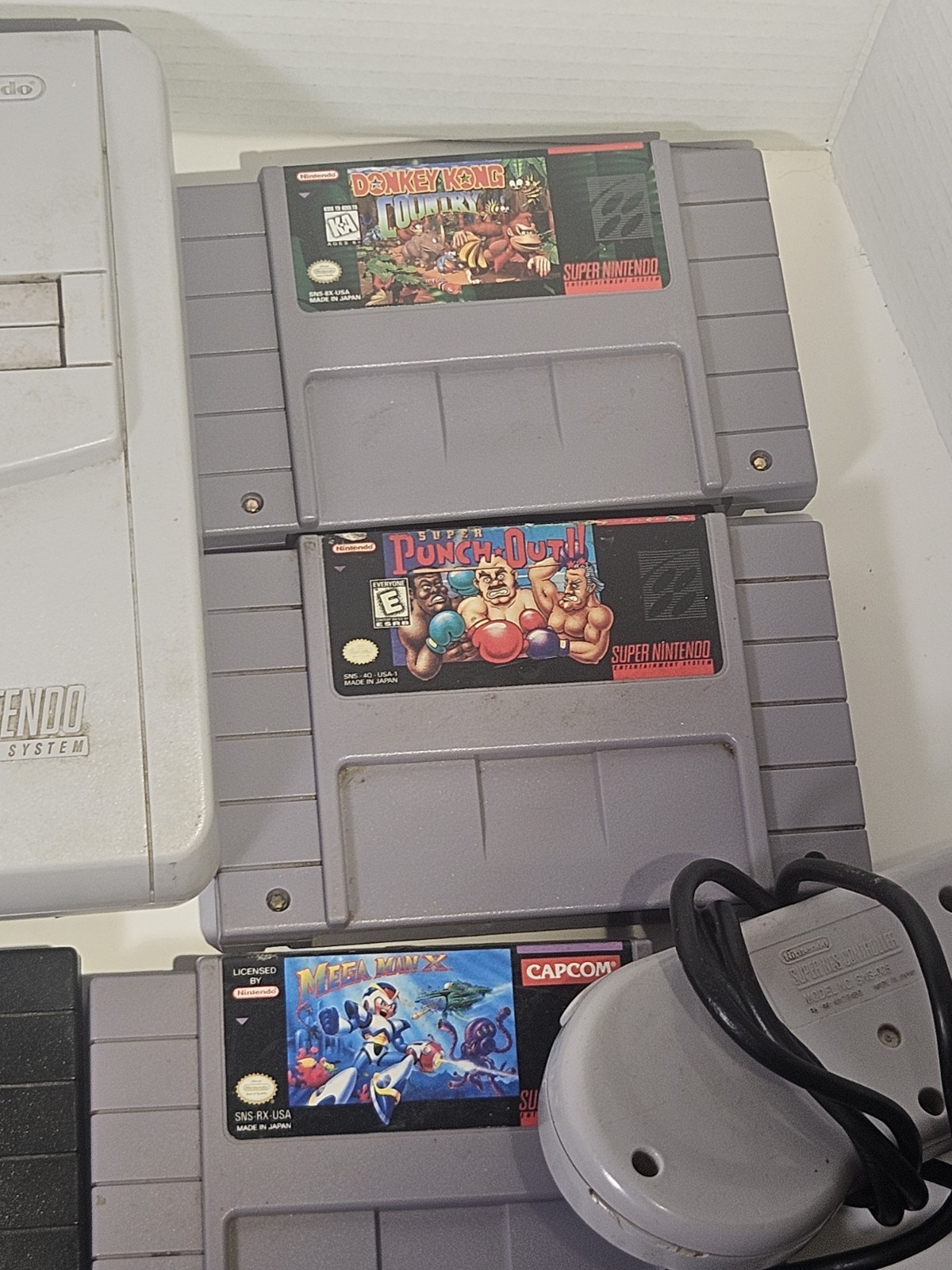 Super Nintendo SNES JR Console with 8 games, cords, and 1 controller