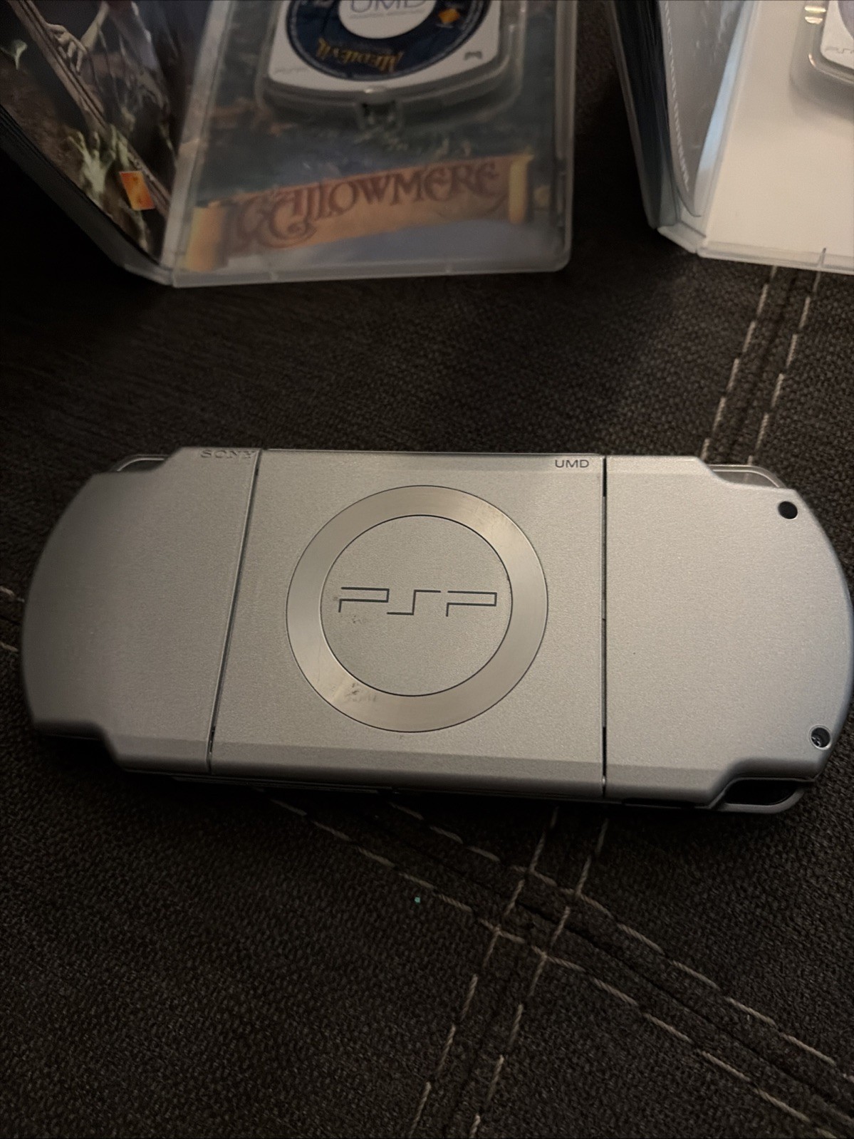 Sony PSP 2001 Handheld Console System Silver with 3 games and 1 movie.