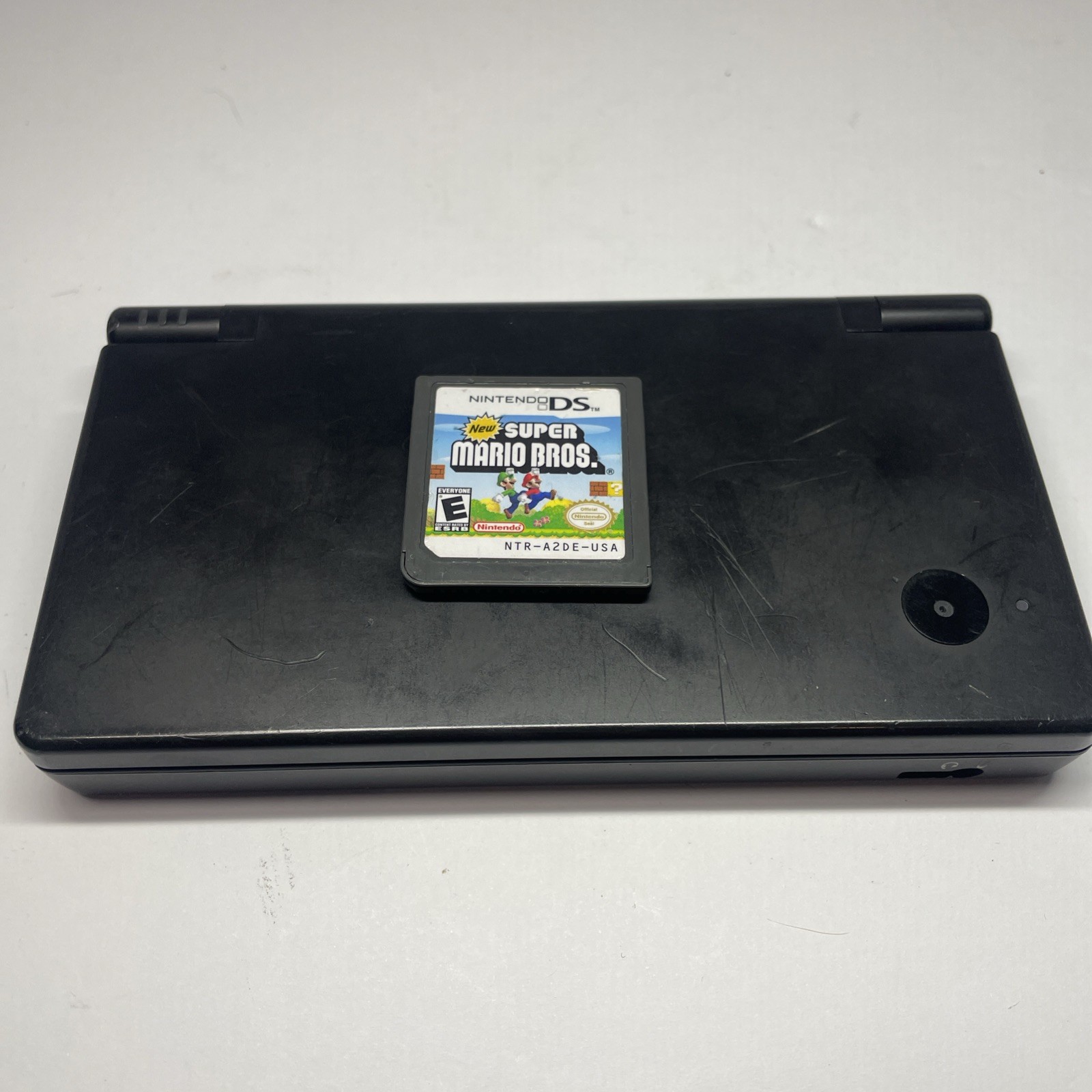 Nintendo DSi TWL-001 Black handheld system w/ Mario Bros -needs charger