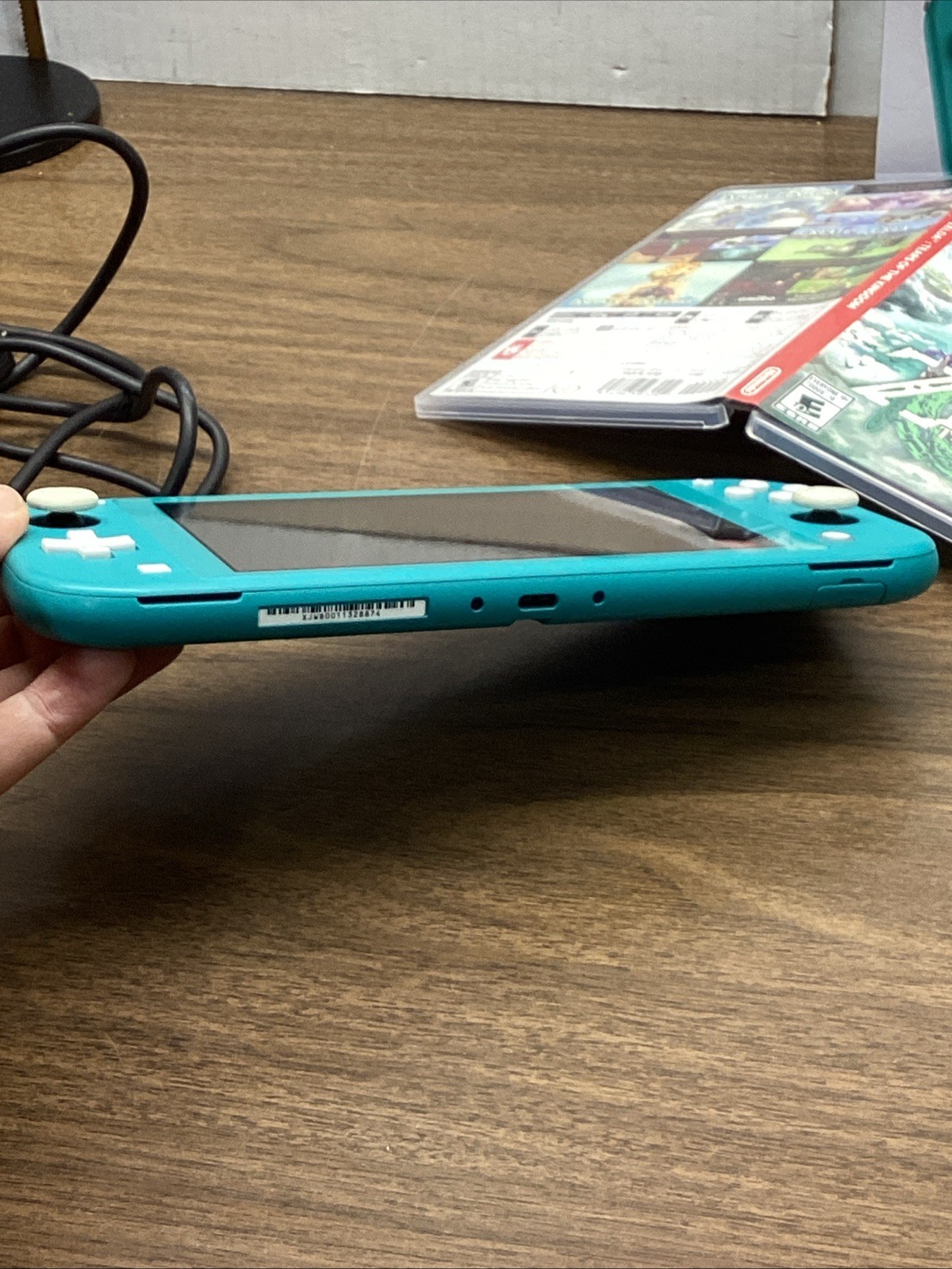 Nintendo Switch Lite Turquoise Teal Handheld Console Bundle with Zelda Game