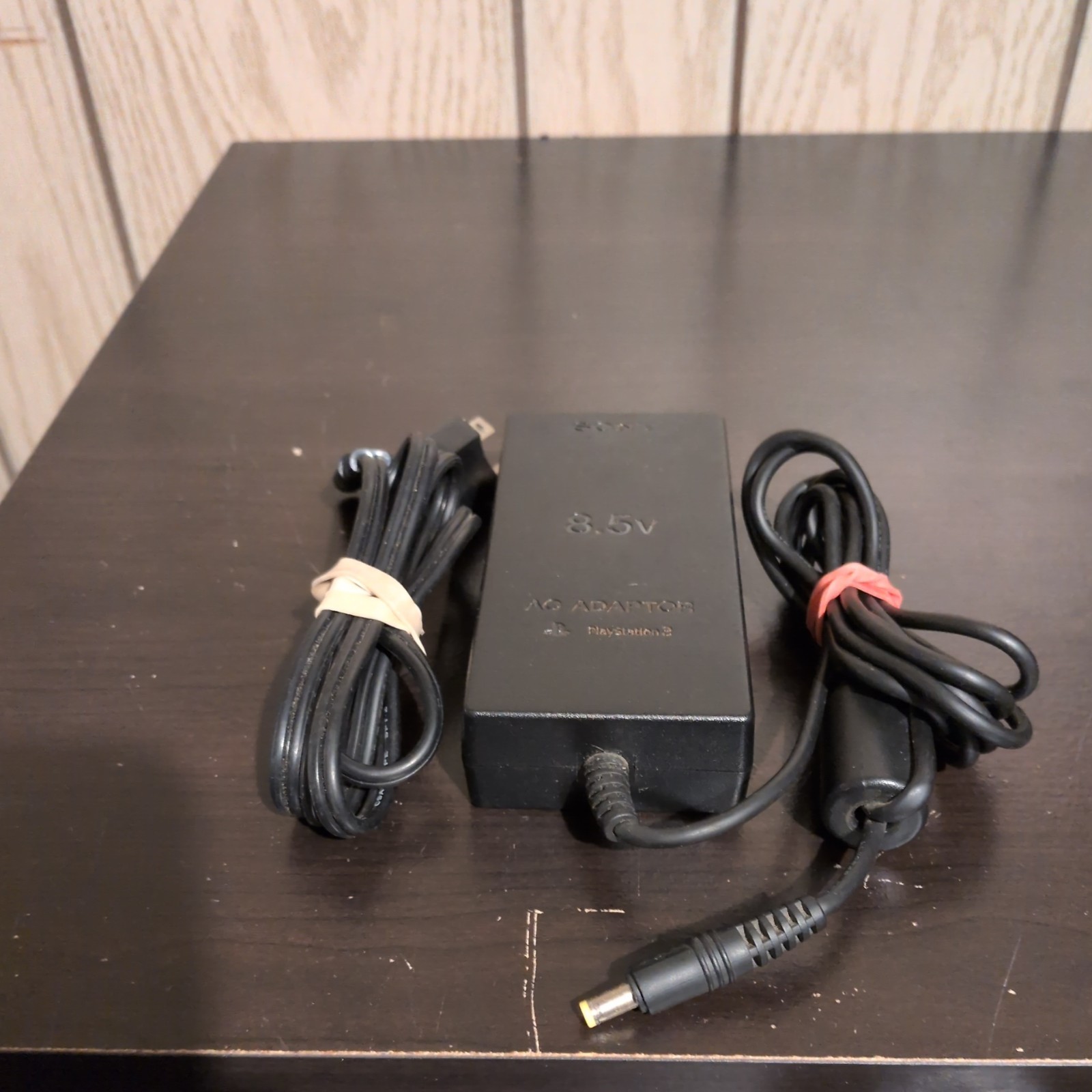 2 Sony PlayStation Consoles (w/Controllers, Cable, & 2 8MB Memory Cards)