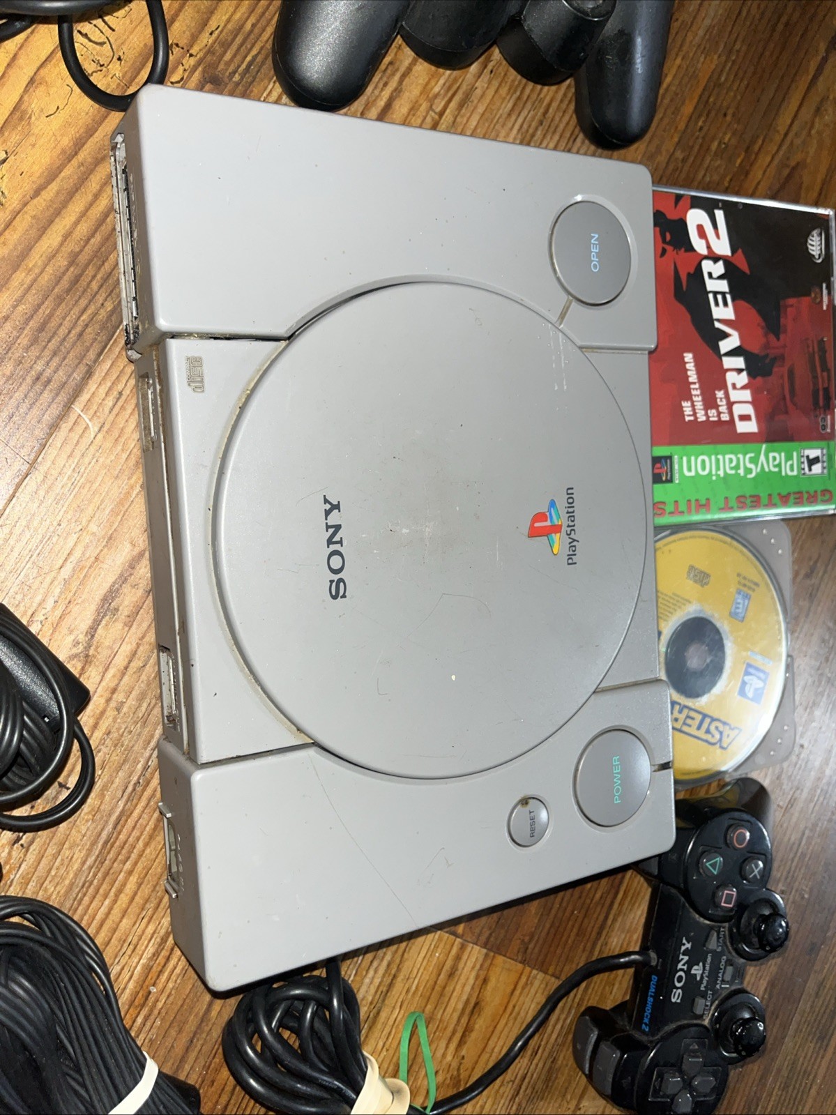 Sony Playstation 1 Gray Console With Games Controllers, A/V Cable, and Power