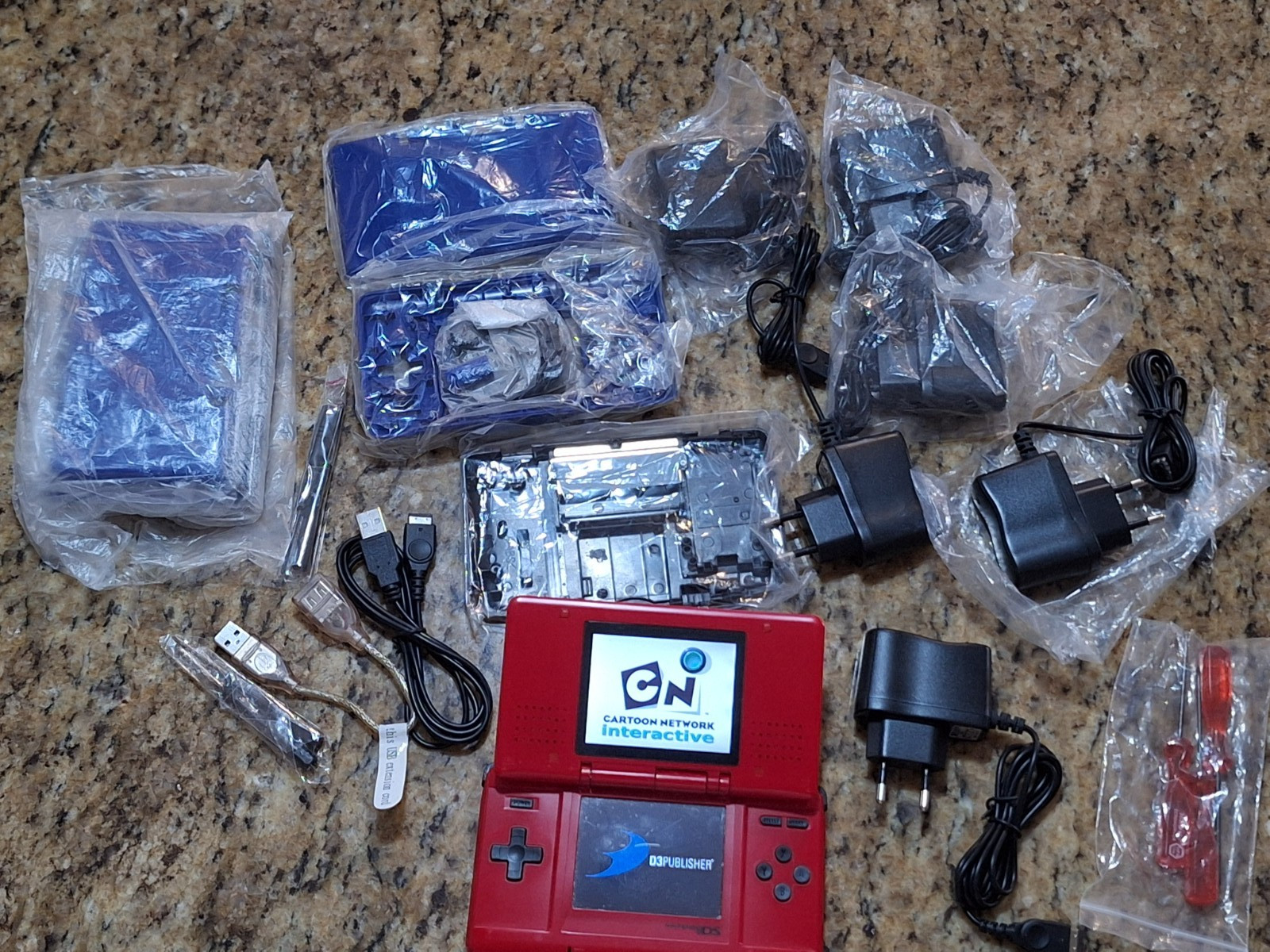 NINTEDO DS LOT W 1 CONSOLE 2 SHELLS 6 EU AC CORDS 1 USB CORD & SCREWDRIVER SETS