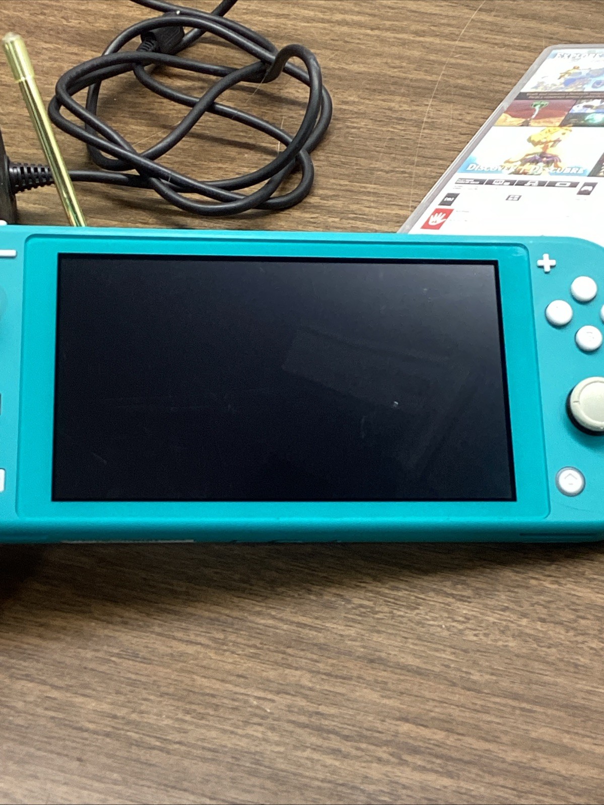 Nintendo Switch Lite Turquoise Teal Handheld Console Bundle with Zelda Game