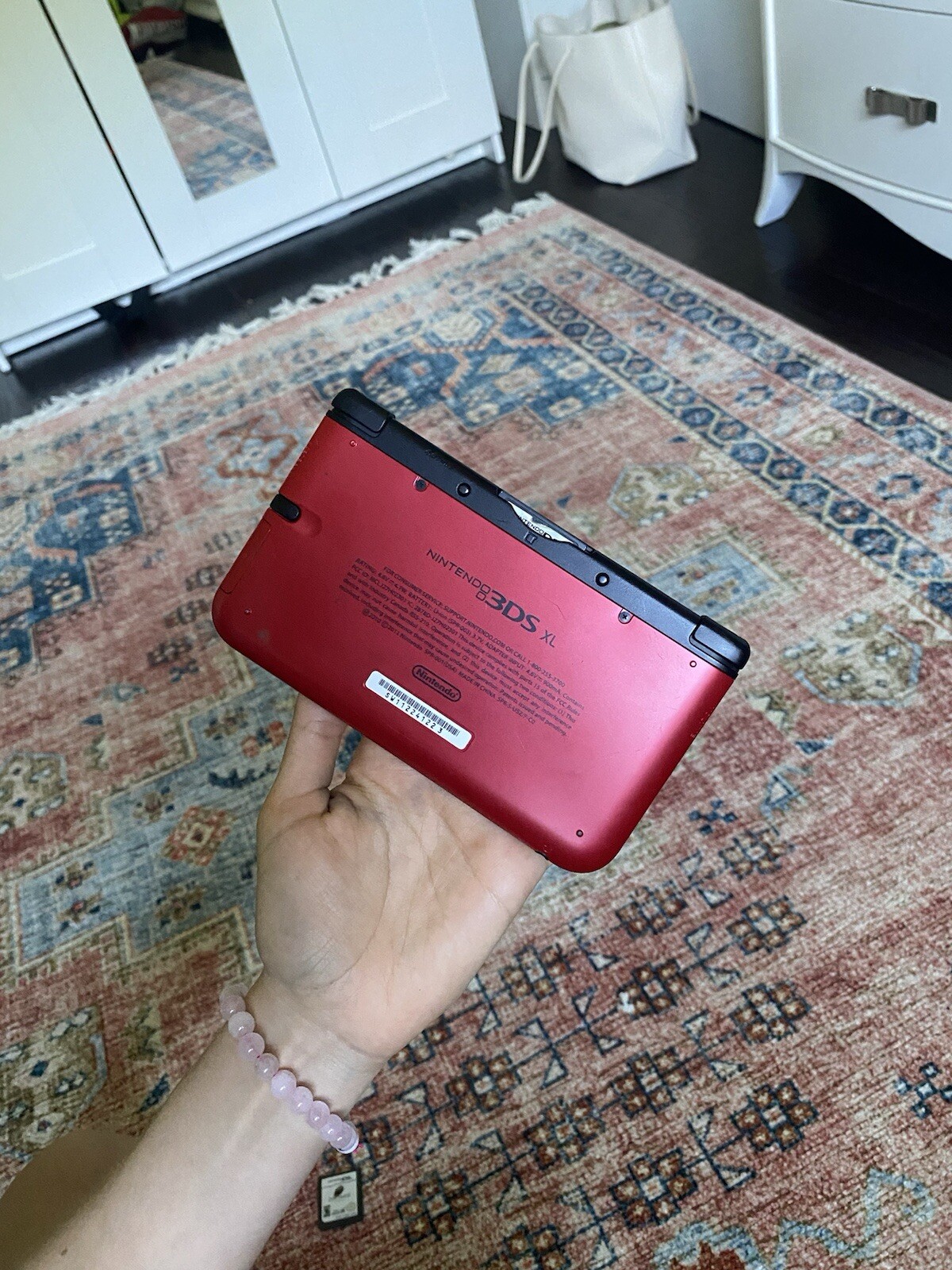 Red Nintendo 3DS XL with 3 games, charger not included
