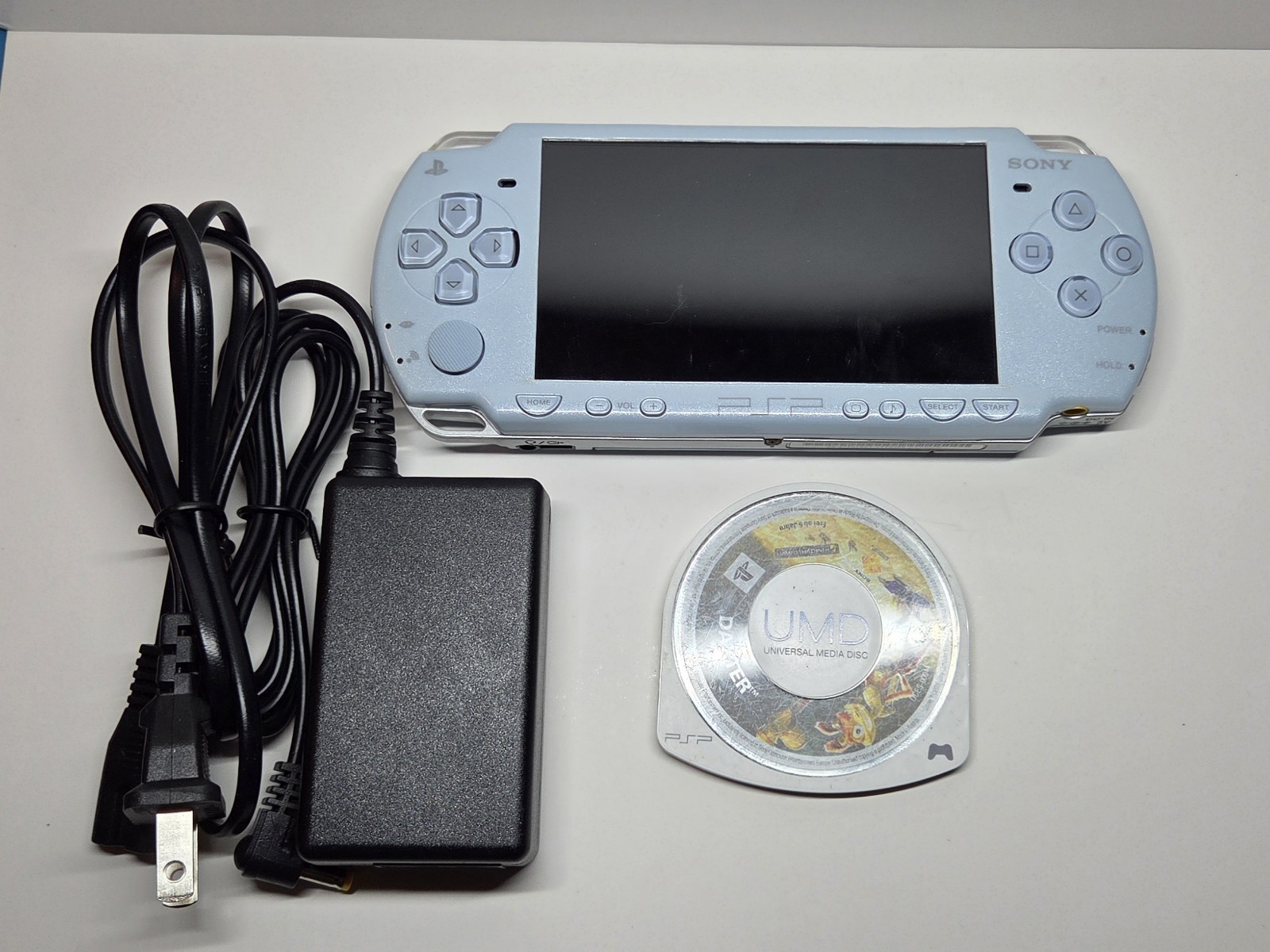 Sony PSP 2000 Felicia Light Blue OEM Tested & Working + Battery, Charger, + Game
