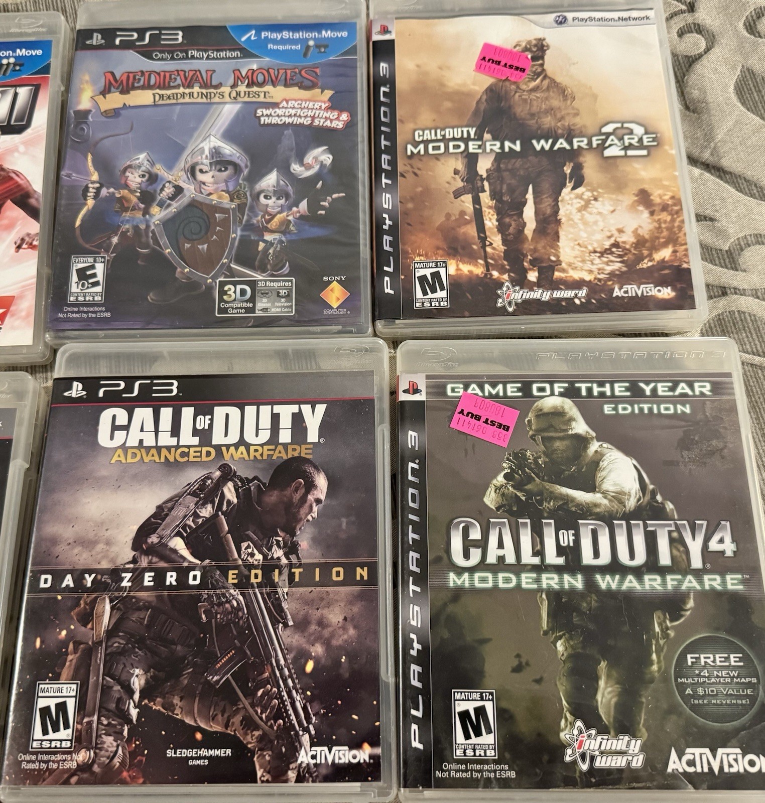 PlayStation 3 Console, Remotes, and 12 game Bundle