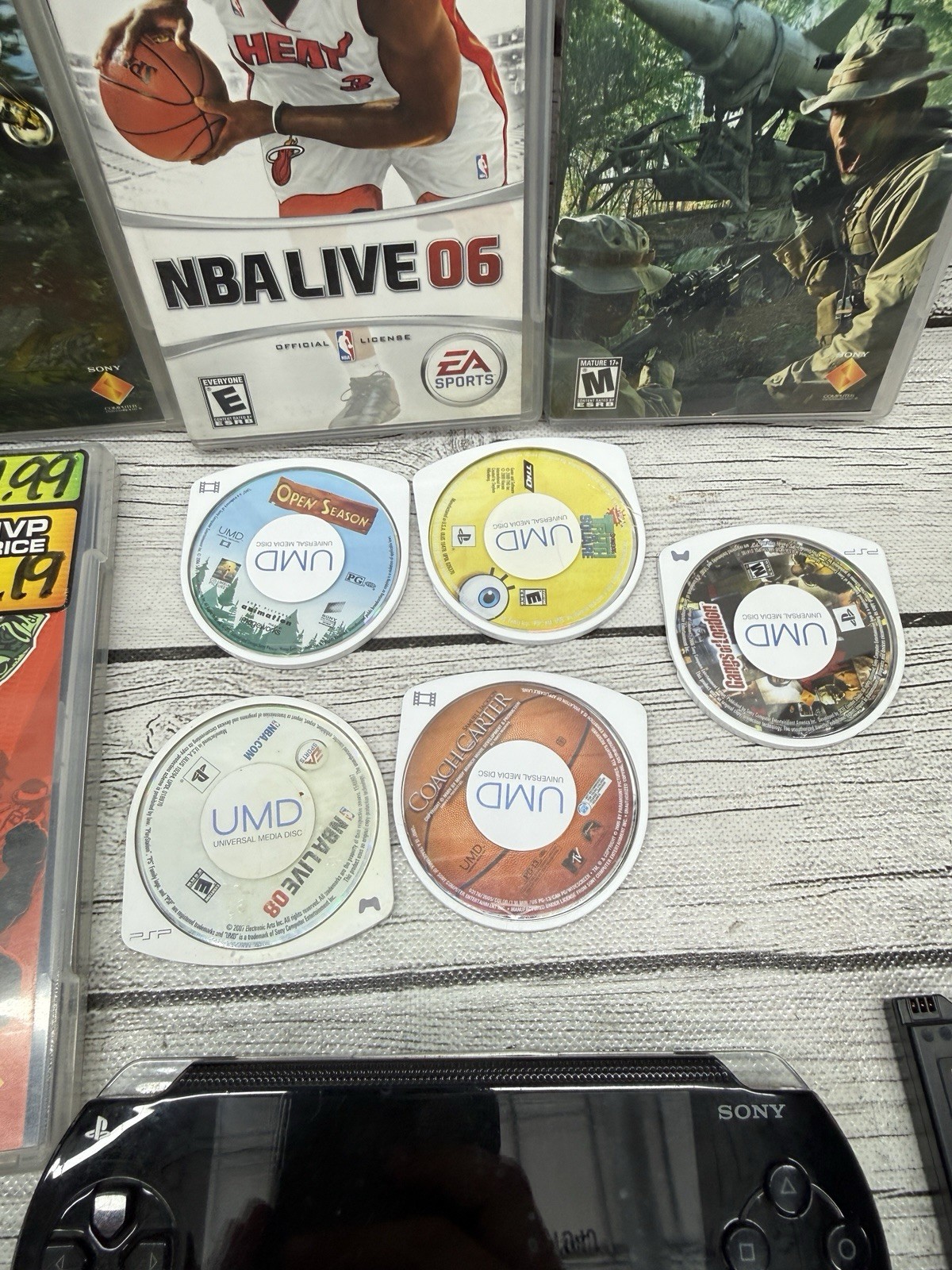 Sony PSP-1001 Black Console With Charger, 1GB Sony Storage Memory Card, 5 Games