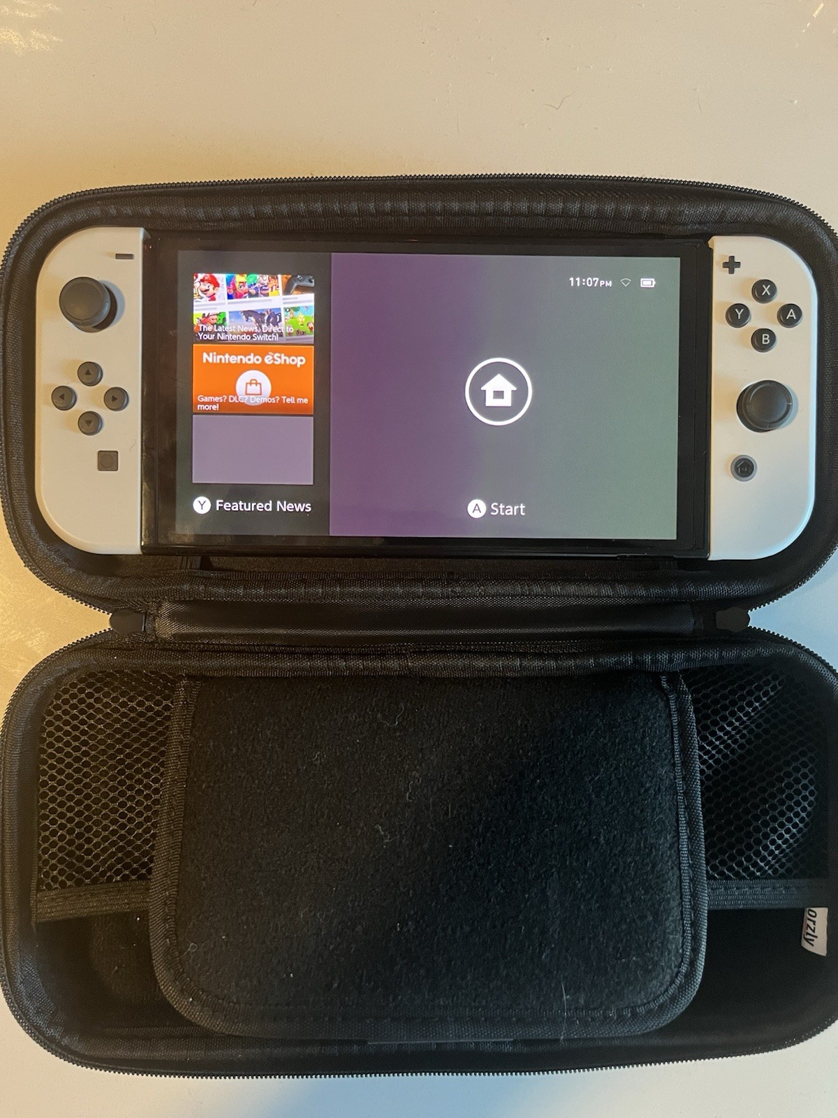 Nintendo Switch OLED Model 64GB 1080p White Joy-Cons w/ Black Carry Case