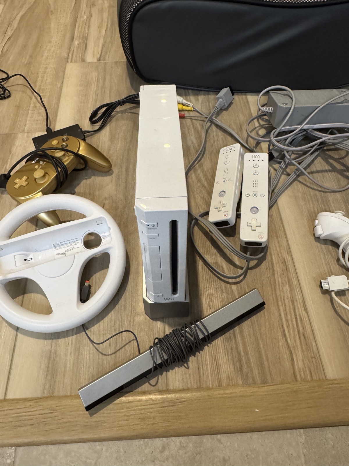 Nintendo Wii Game Console + 2 Remotes, 3 games, 1 goldeneye controller,