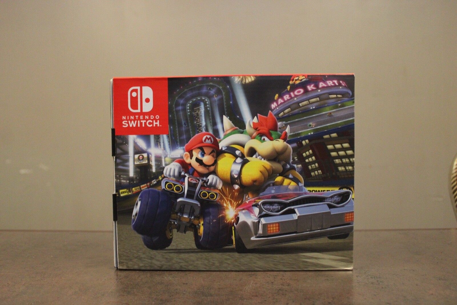 Nintendo Switch with Blue and Red Joy-Con Controllers and Mario Kart 8 Bundle 