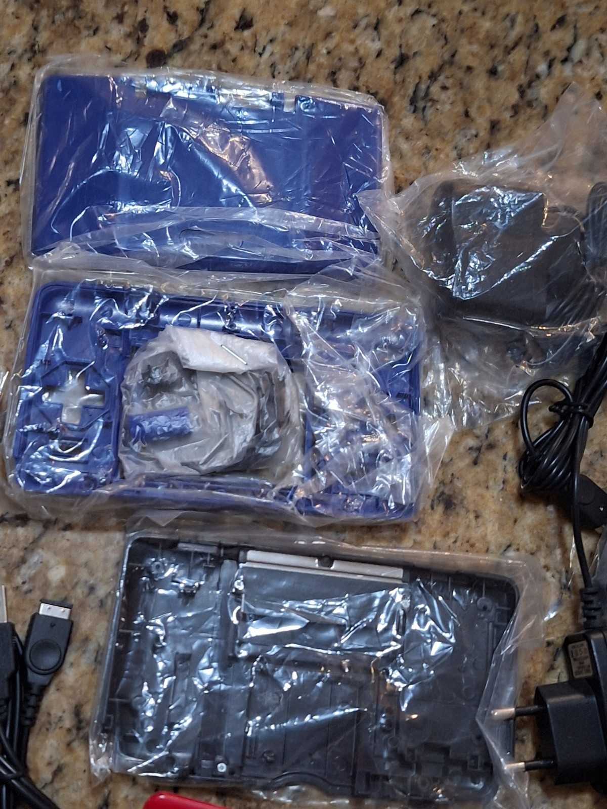 NINTEDO DS LOT W 1 CONSOLE 2 SHELLS 6 EU AC CORDS 1 USB CORD & SCREWDRIVER SETS