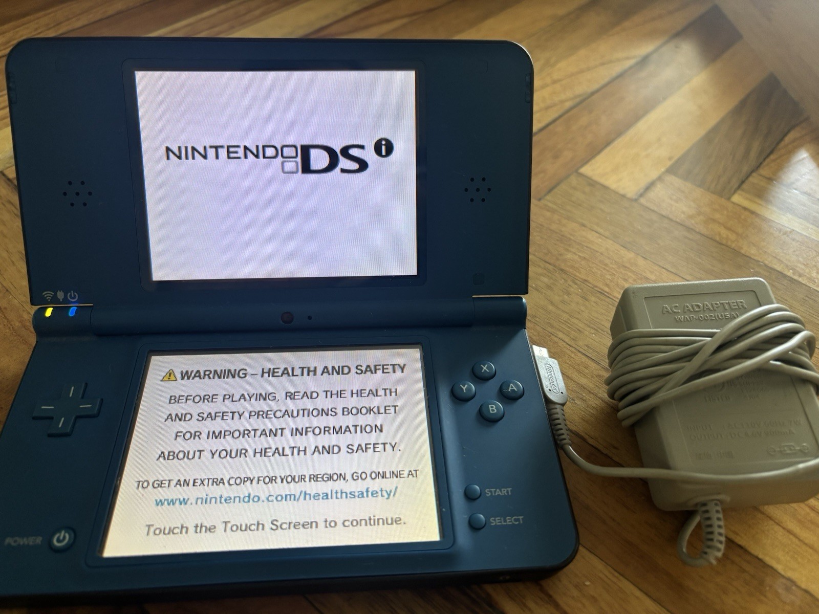 Nintendo DSi XL Blue Handheld System Touchscreen 256MB w/ AC Adapter