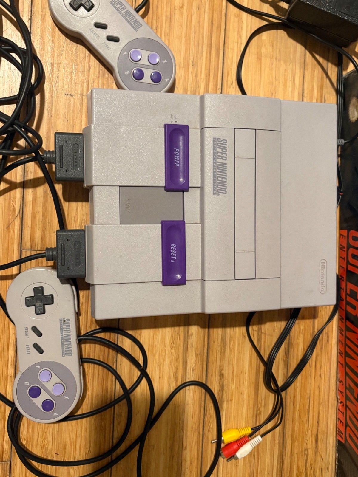 Super Nintendo Console with box and two games, two controllers & manual