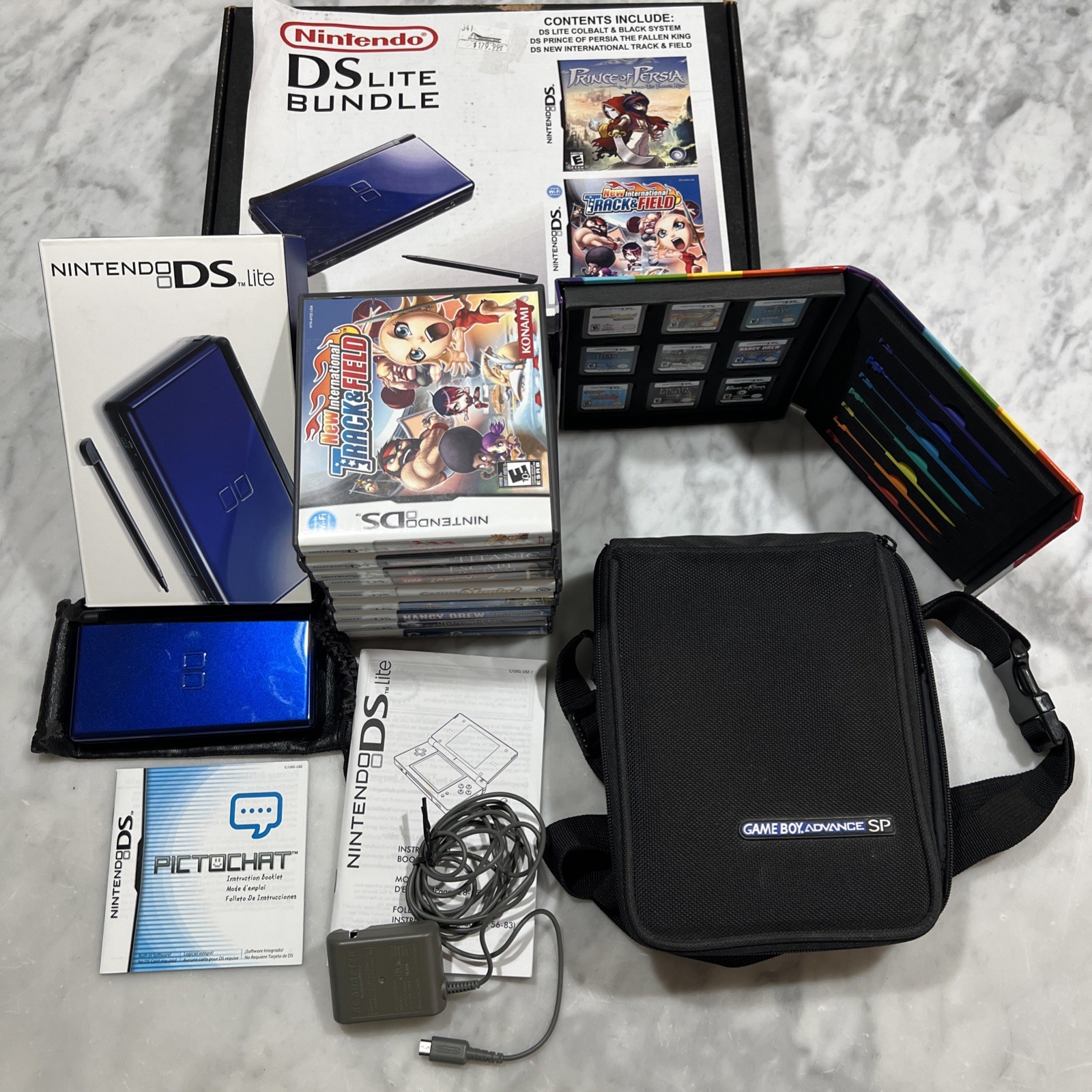 Nintendo DS Lite Cobalt Blue Console Bundle 9 Games New Battery Charger Cases