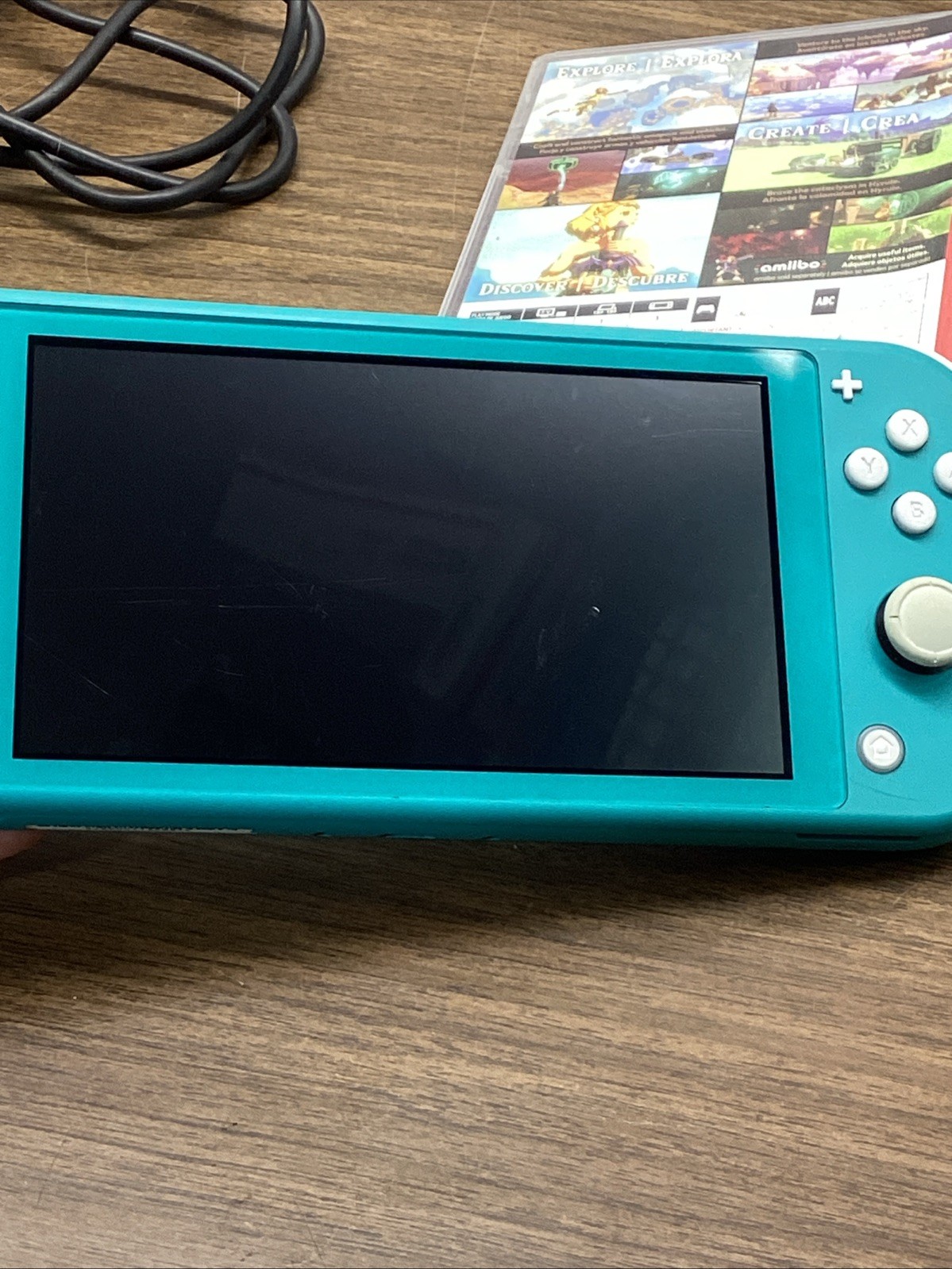 Nintendo Switch Lite Turquoise Teal Handheld Console Bundle with Zelda Game