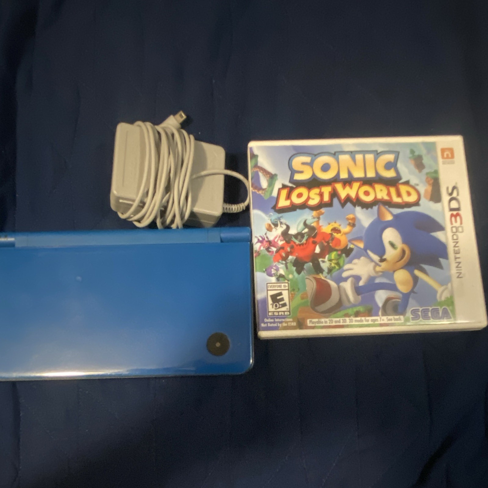 Nintendo DSi XL Blue Handheld System Touchscreen w/ Charger and sonic game