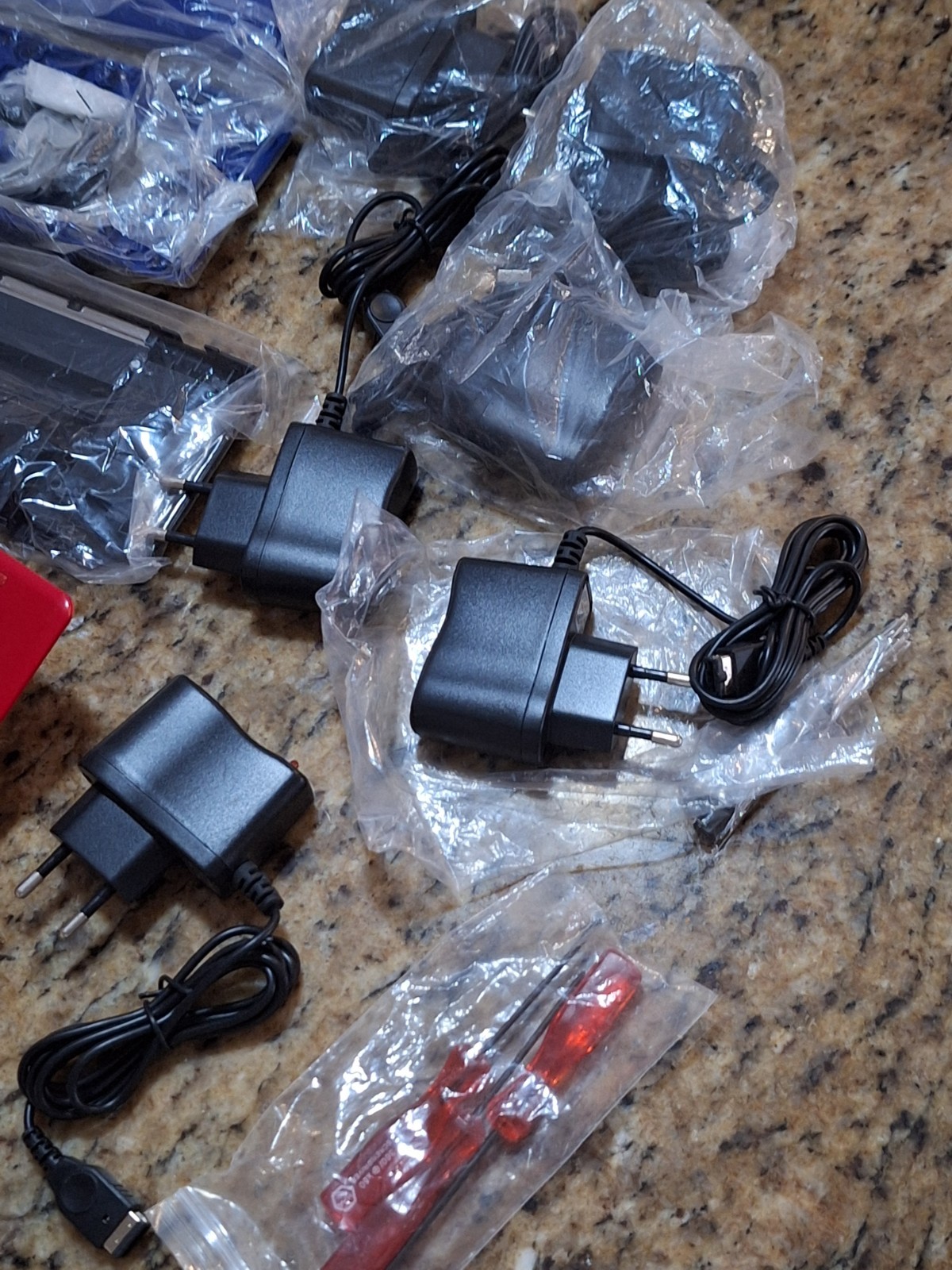 NINTEDO DS LOT W 1 CONSOLE 2 SHELLS 6 EU AC CORDS 1 USB CORD & SCREWDRIVER SETS