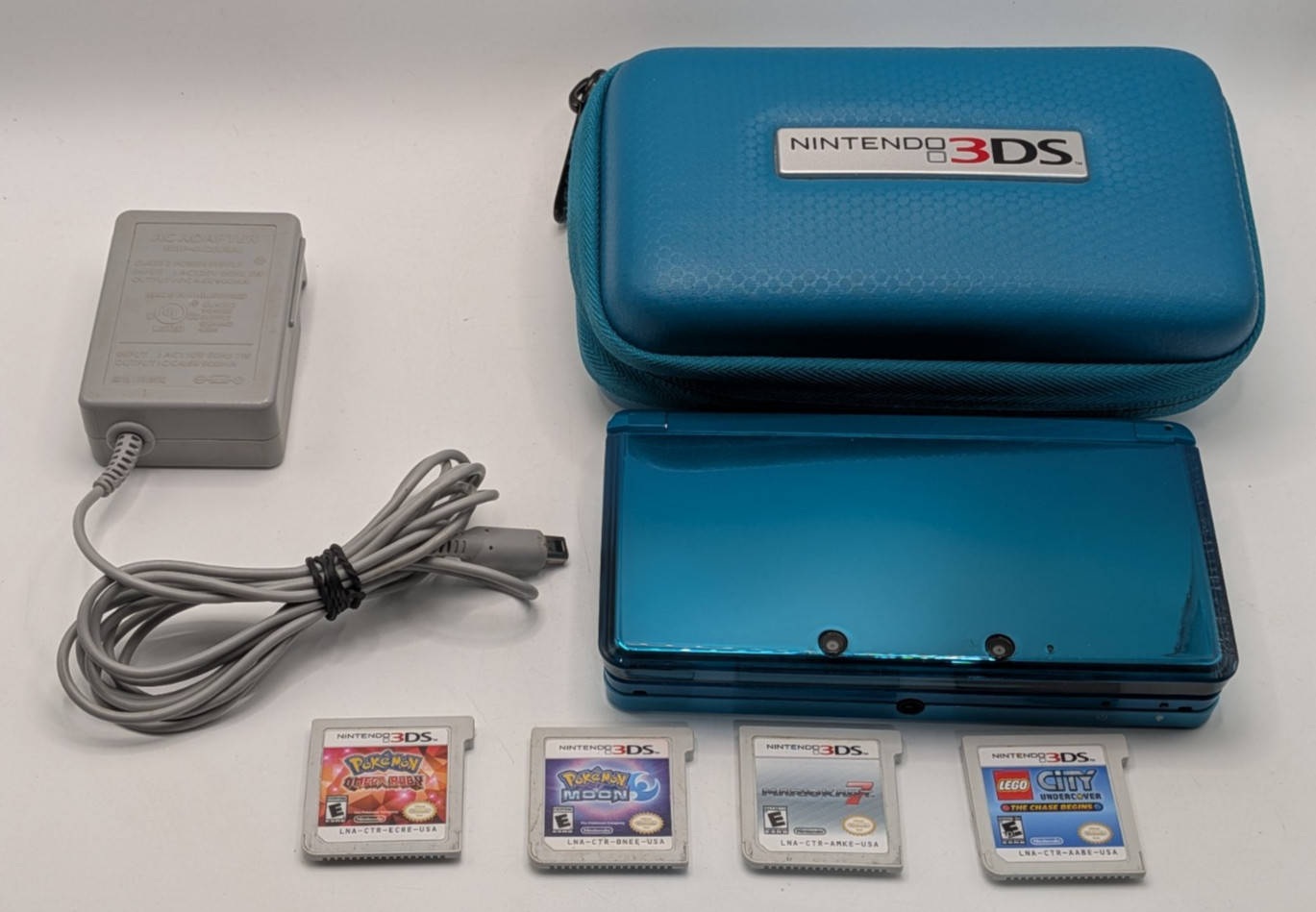 Nintendo 3DS Blue Console Bundle Blue 4 Games Pokemon Moon Ruby Mario Kart 7