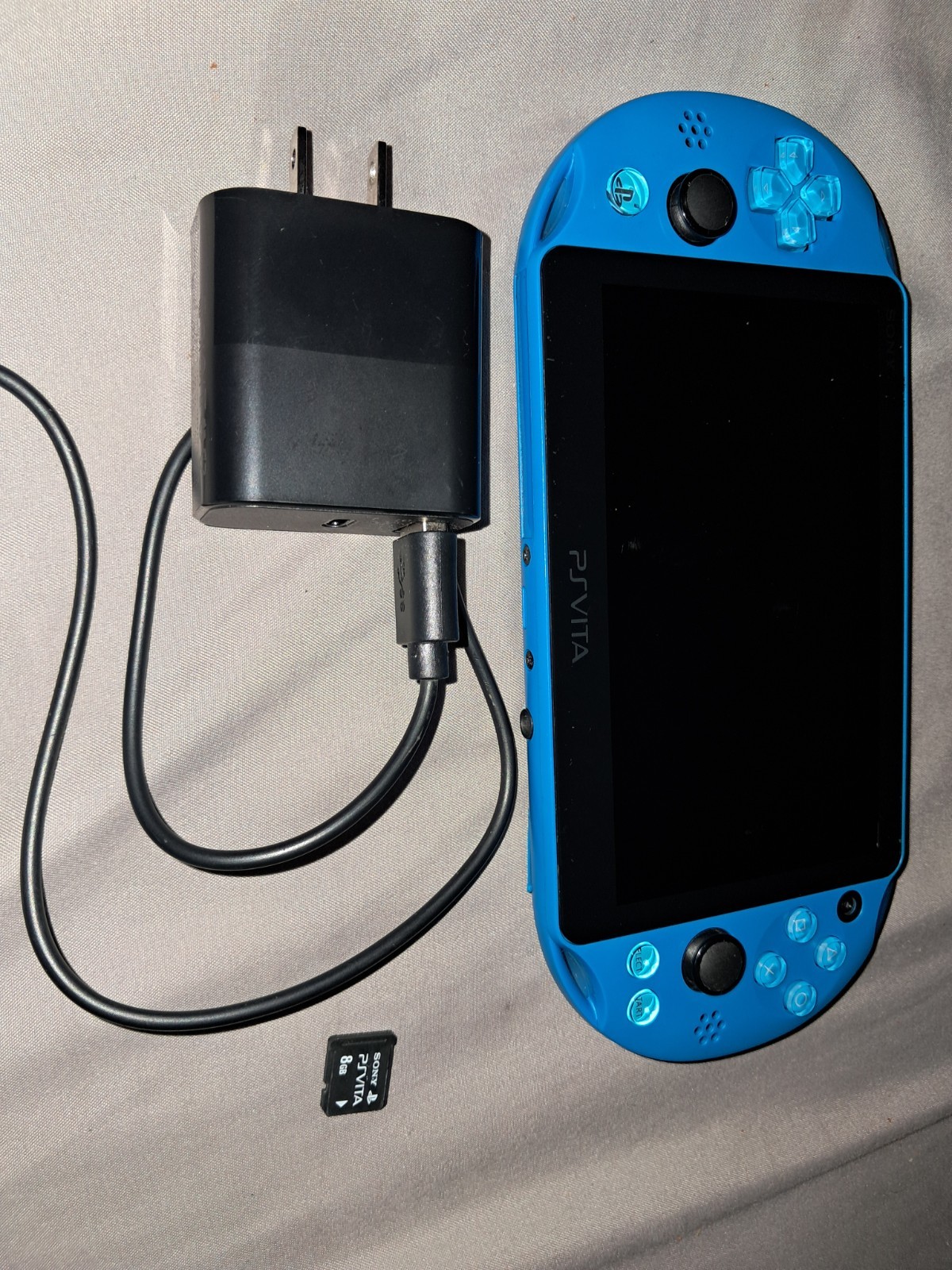 Sony PS Vita PCH-2000 Blue Handheld System Console Wi-Fi with charger and sd