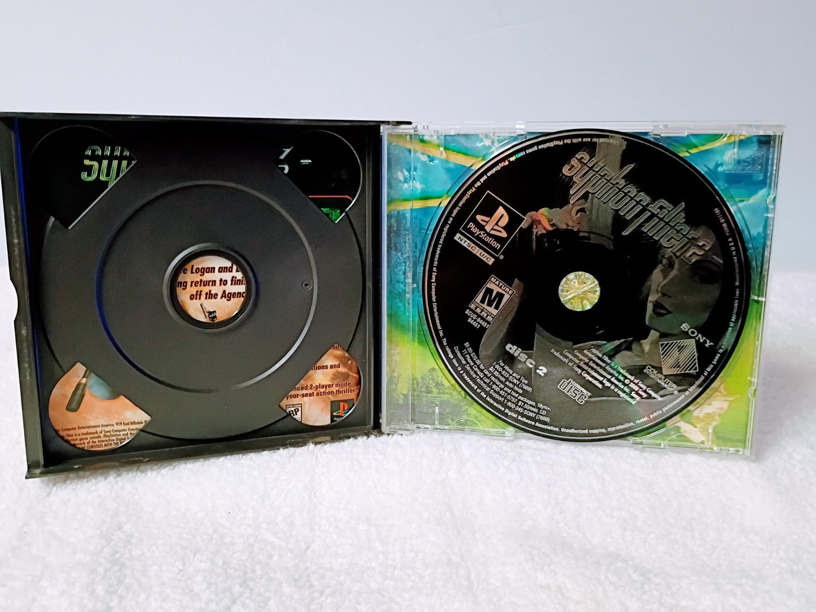 Playstation 1 with 1 controller, AV Cable, power cable and Syphon Filter 2 game
