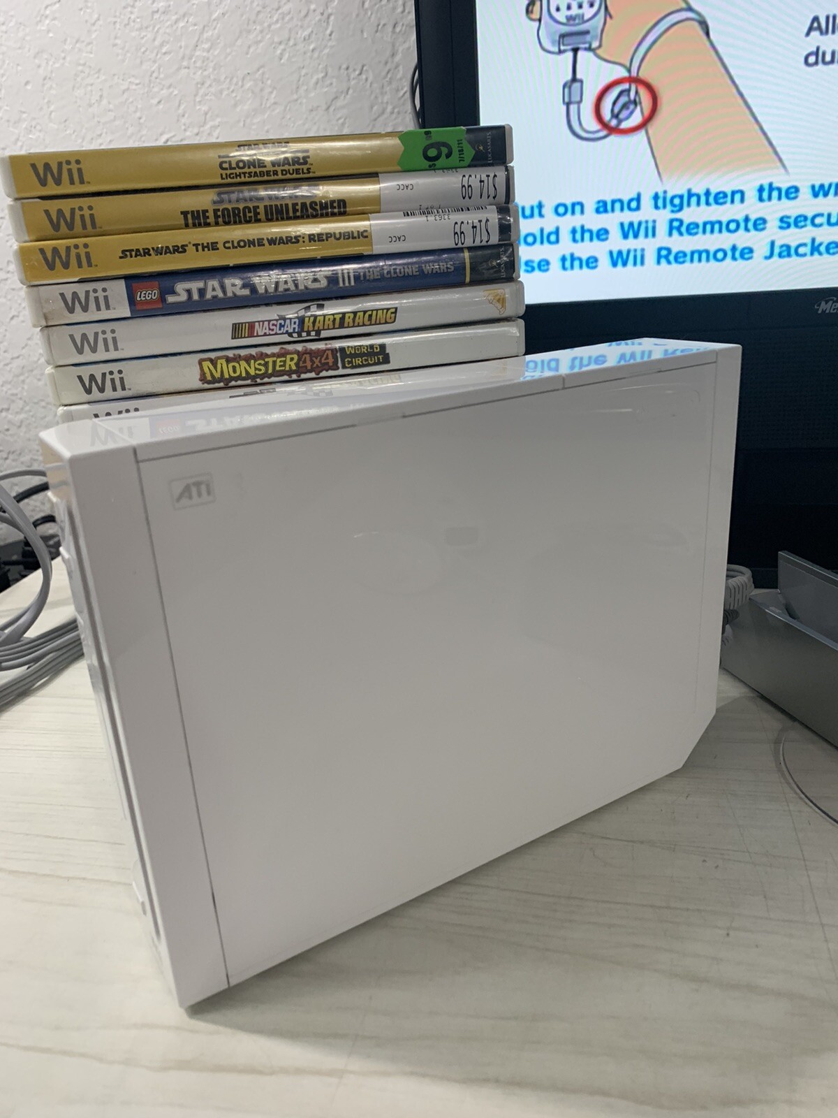 Nintendo RVL-100 Wii Bundle with 35 Games 1 controller 1 Nunchuk Stand Cables