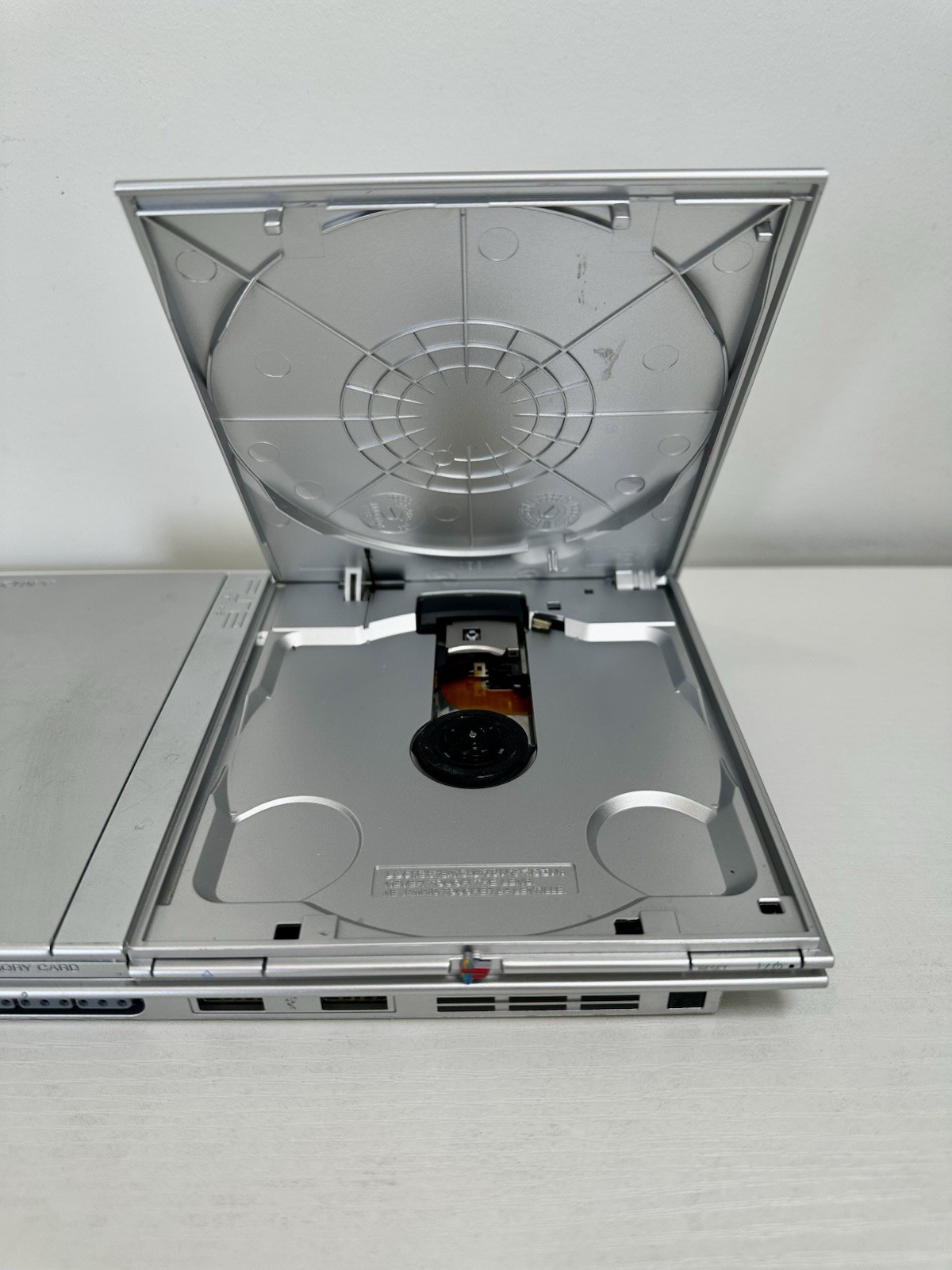 Silver PlayStation 2 Slim OEM Bundle – OEM Controller, OEM Cables, Memory Card