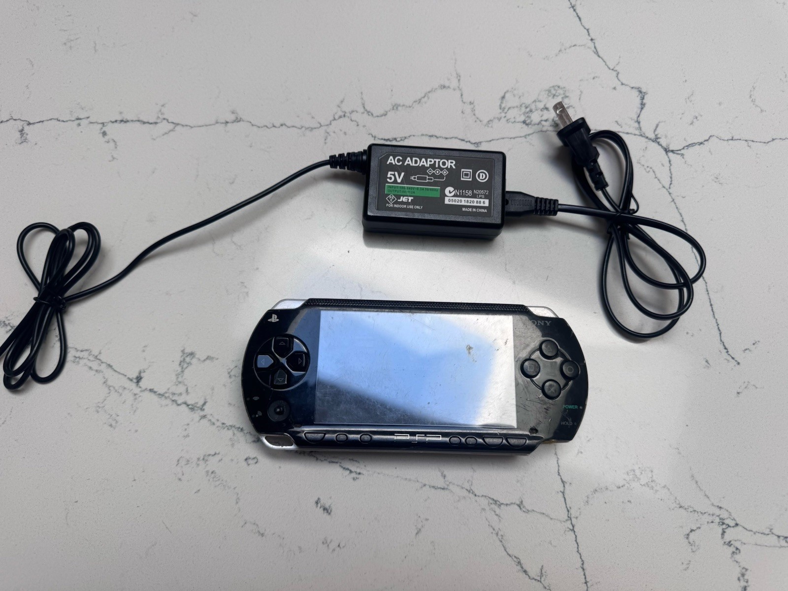 Sony PSP-1001 PlayStation Portable – Black With 8 Discs And Power Cord