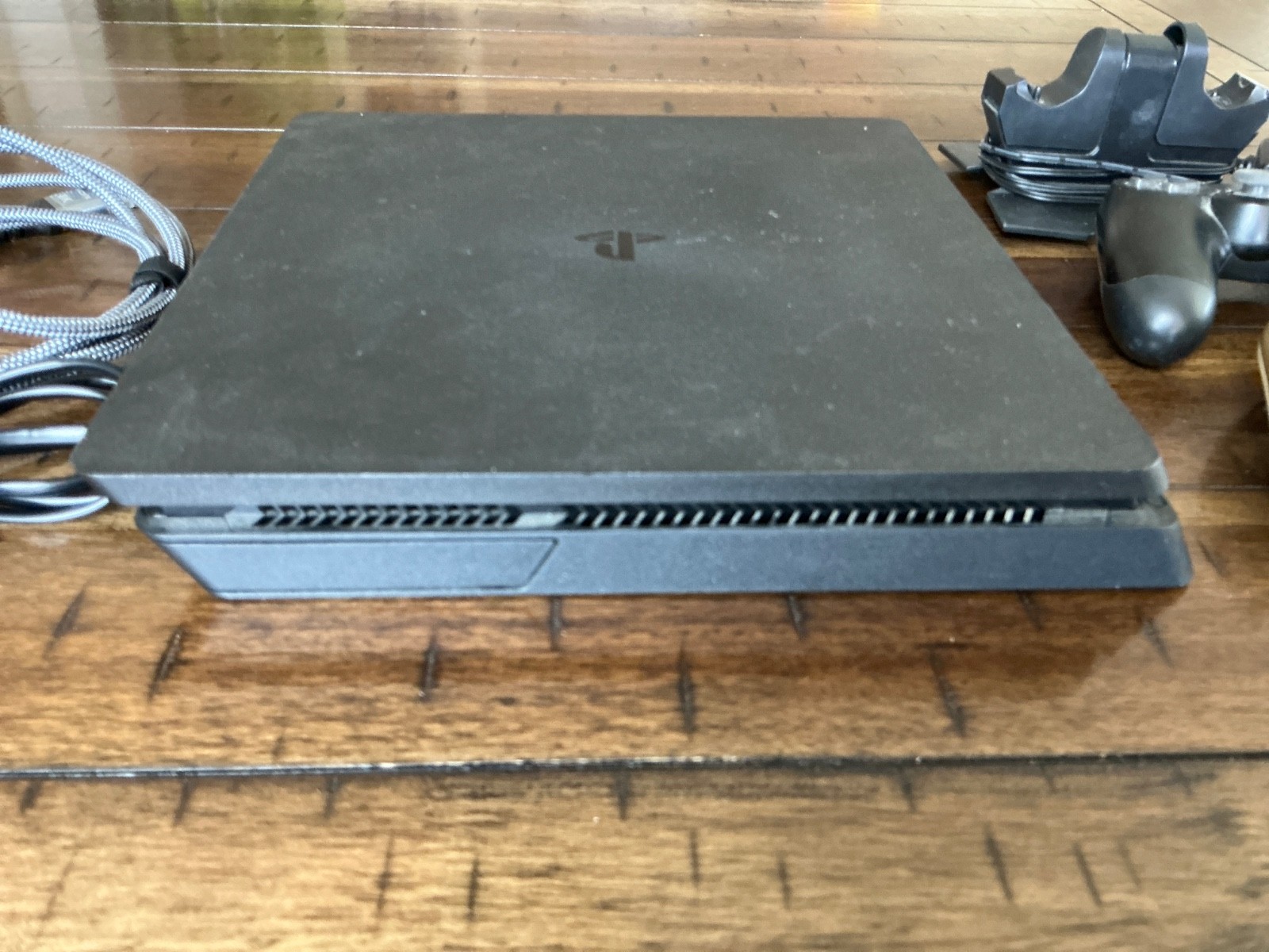 Sony PlayStation 4 Slim Console, two Controllers, Controller Dock and cables
