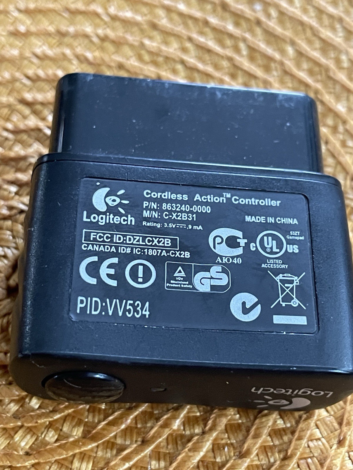 A Logitech PID VV-534 Cordless Action Controller And, A PS-2 8 MB Memory Card