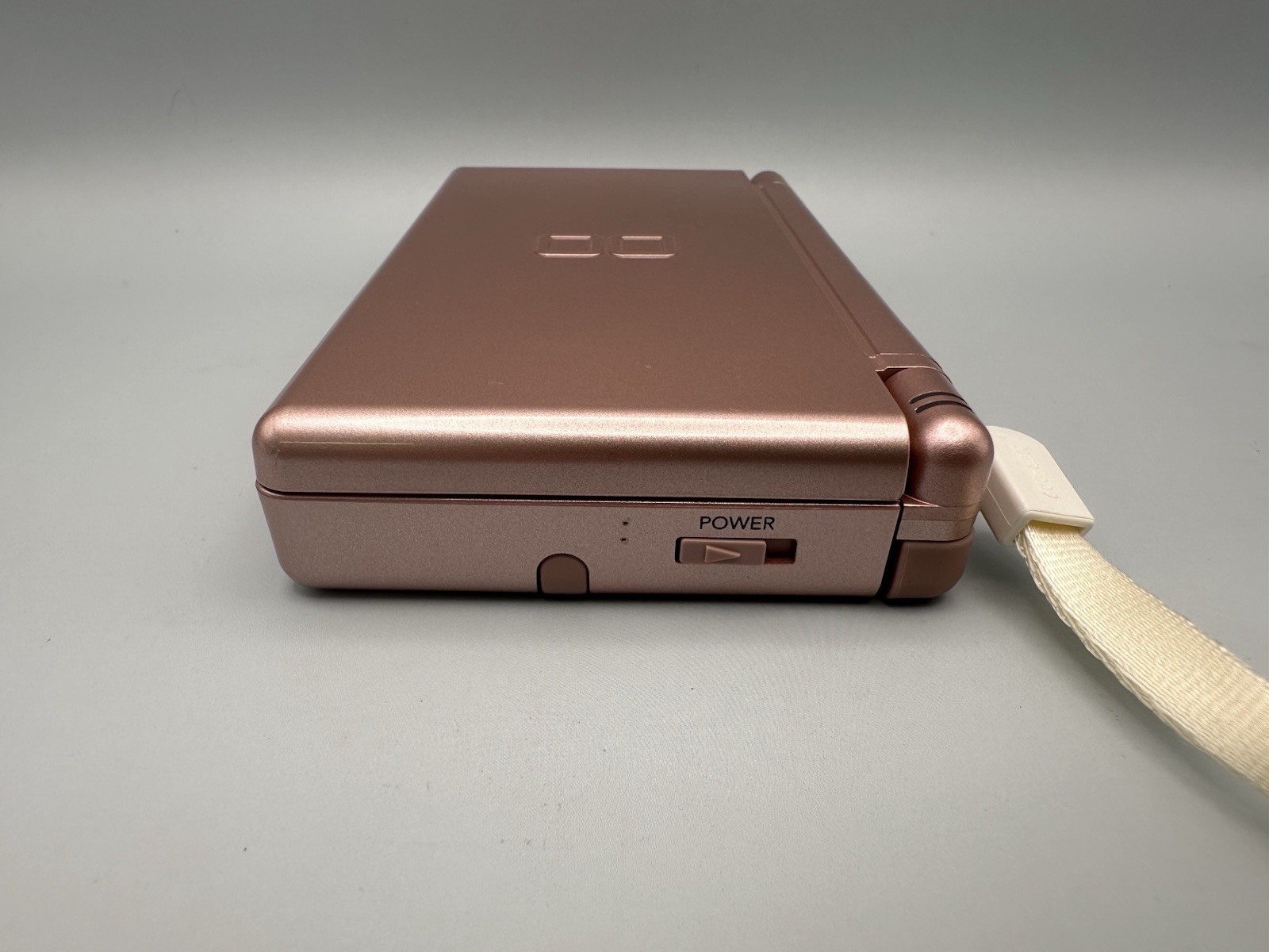 Nintendo DS Lite USG-001 Metallic Rose – original slot cover, stylus, wriststrap