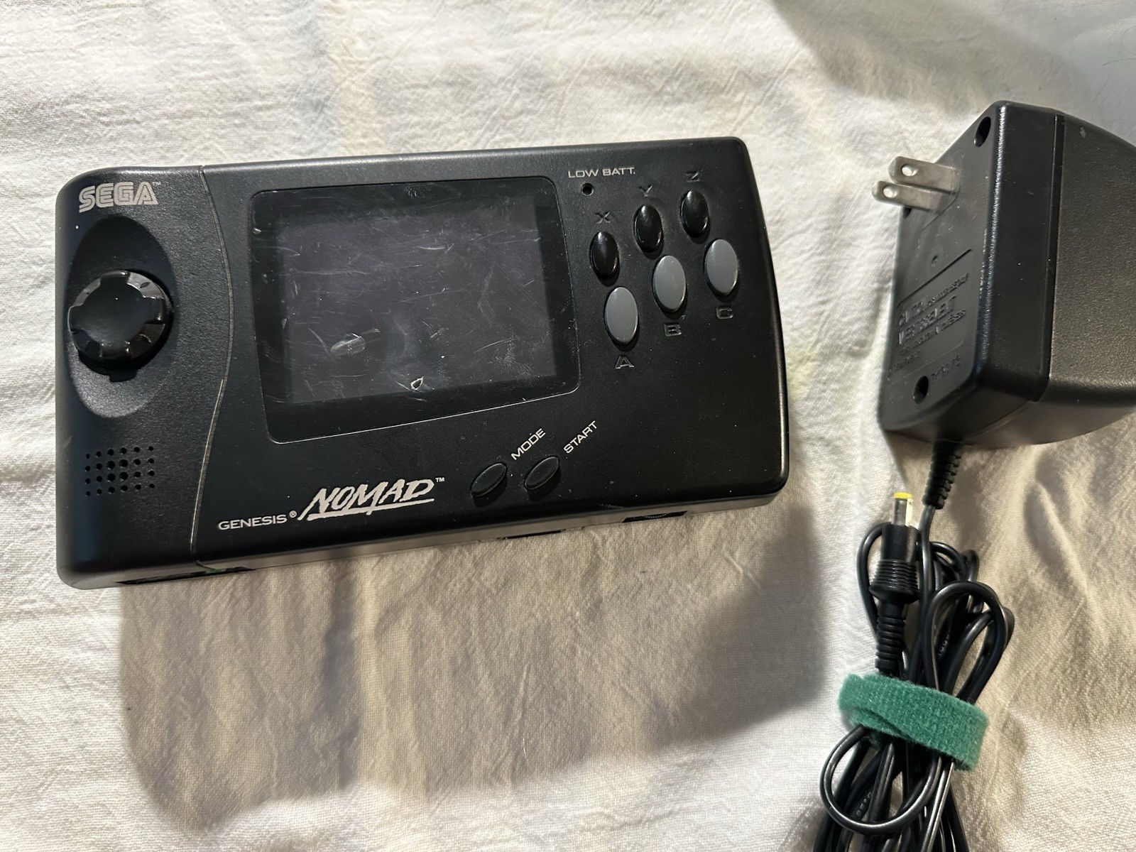 SEGA Genesis Nomad MK-6100 Handheld System W/ power supply. Tested runs great.