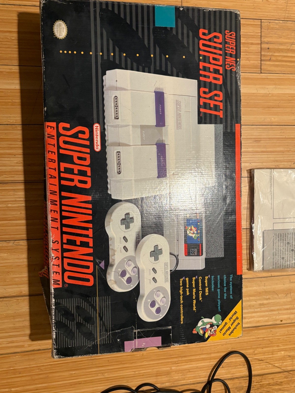 Super Nintendo Console with box and two games, two controllers & manual