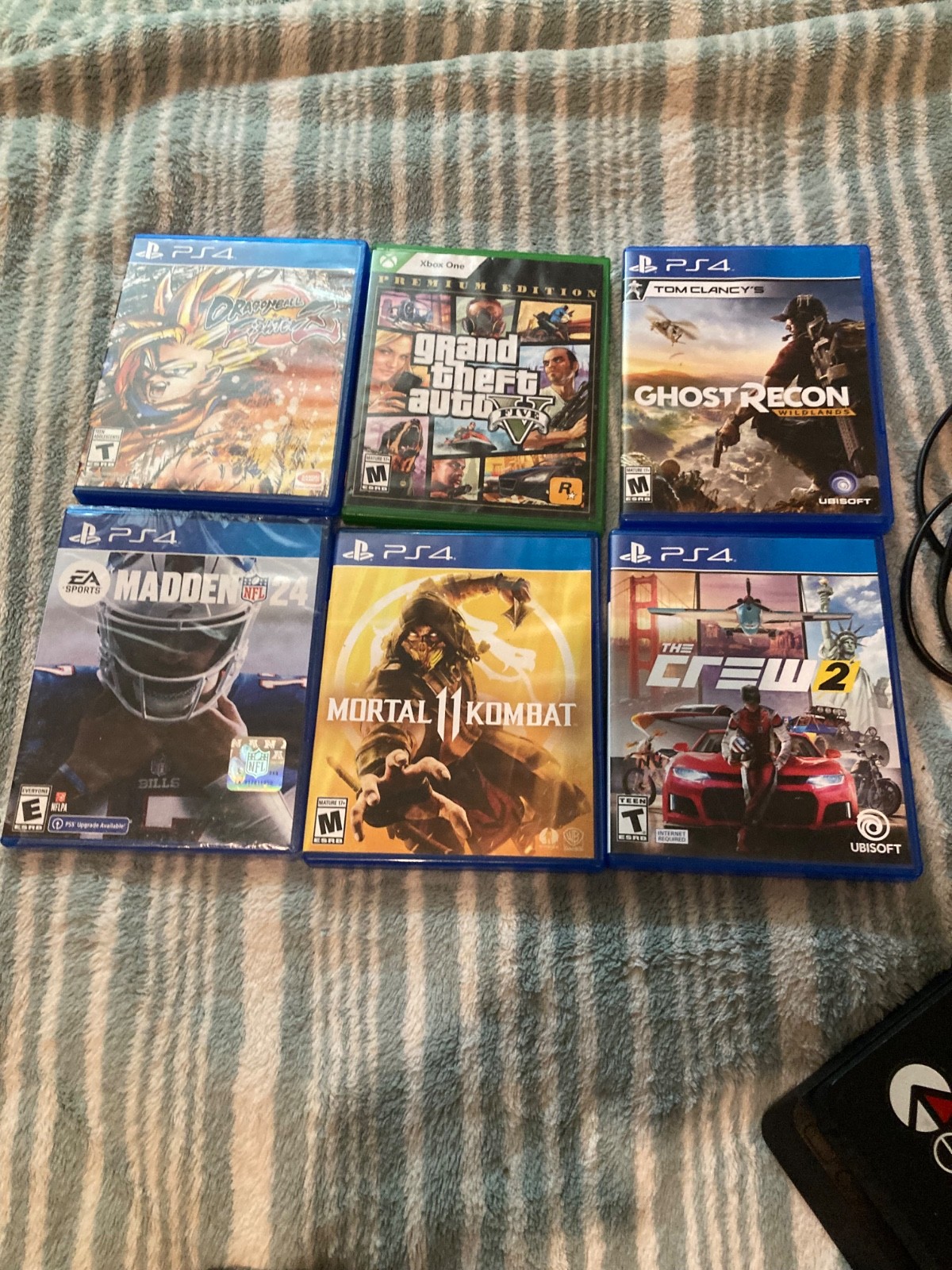 Sony PlayStation 4 Slim with two controllers and 6 games