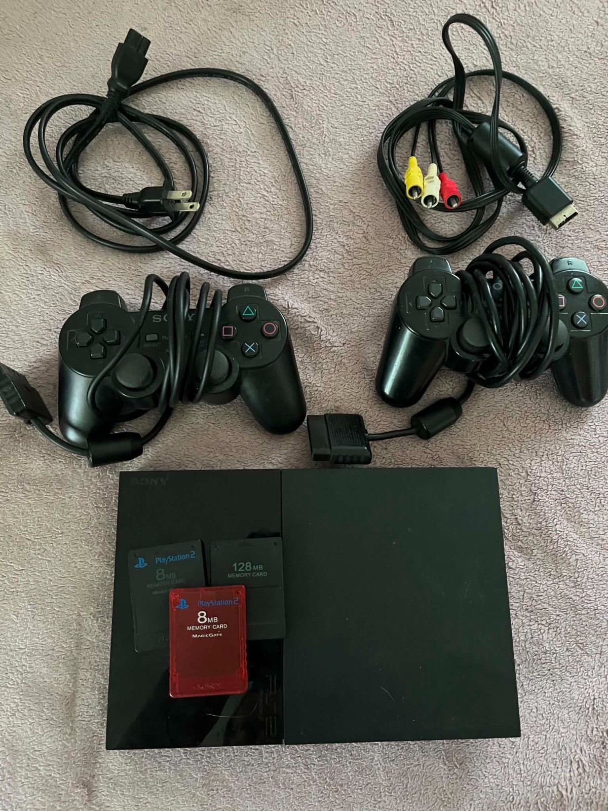 Sony PS2 Slim (w/ cords, two controllers, 4 memory cards) – Tested and working