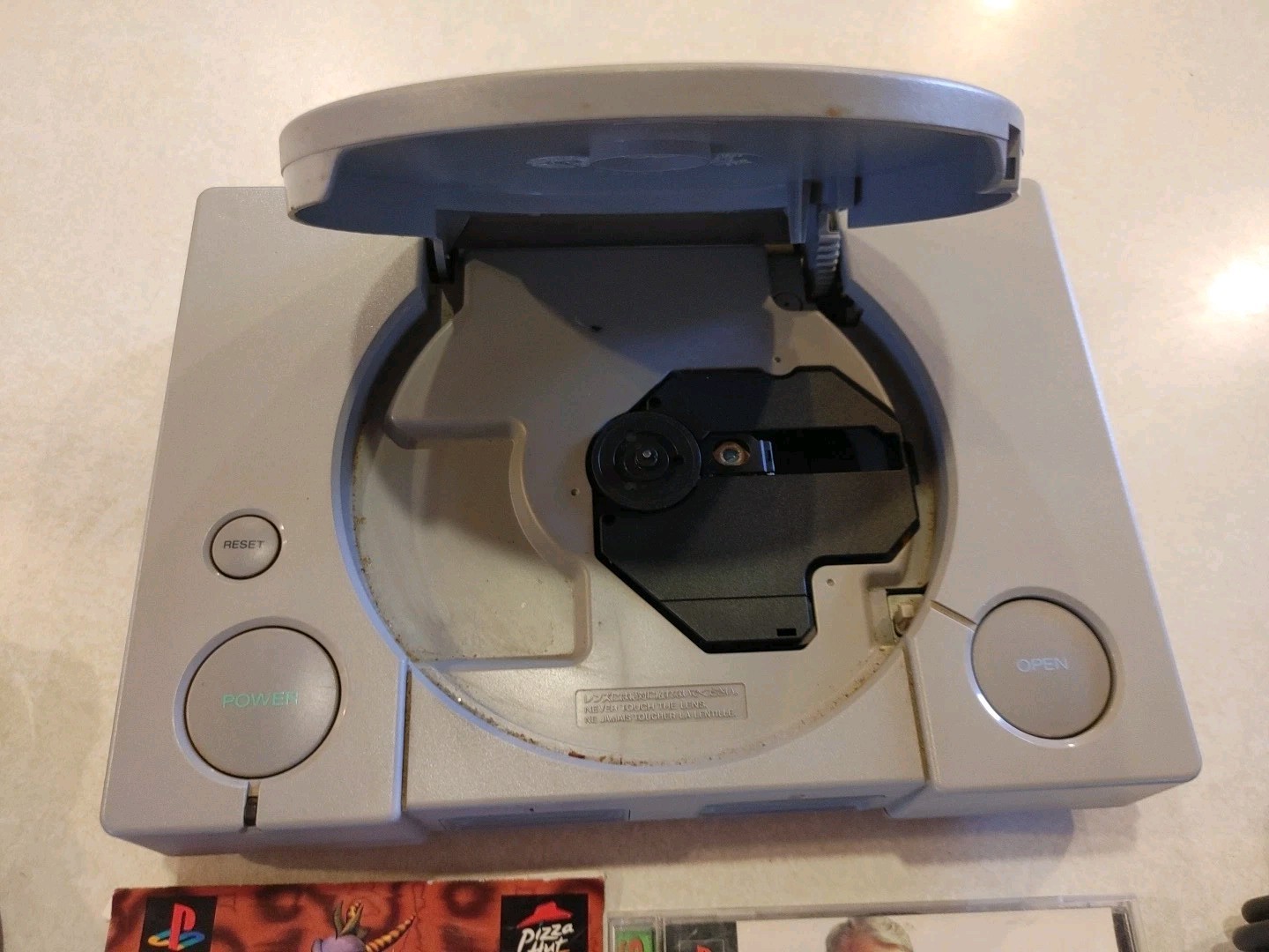 Sony PlayStation Console with two controllers and games