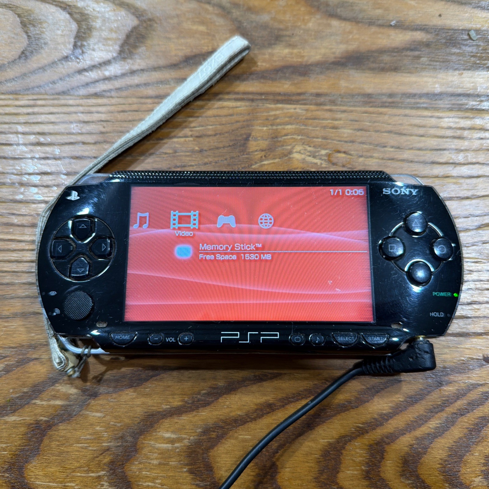 PSP 1001 – Missing Battery – Needs Charger Cord – Comes w/ Games – See Disc.