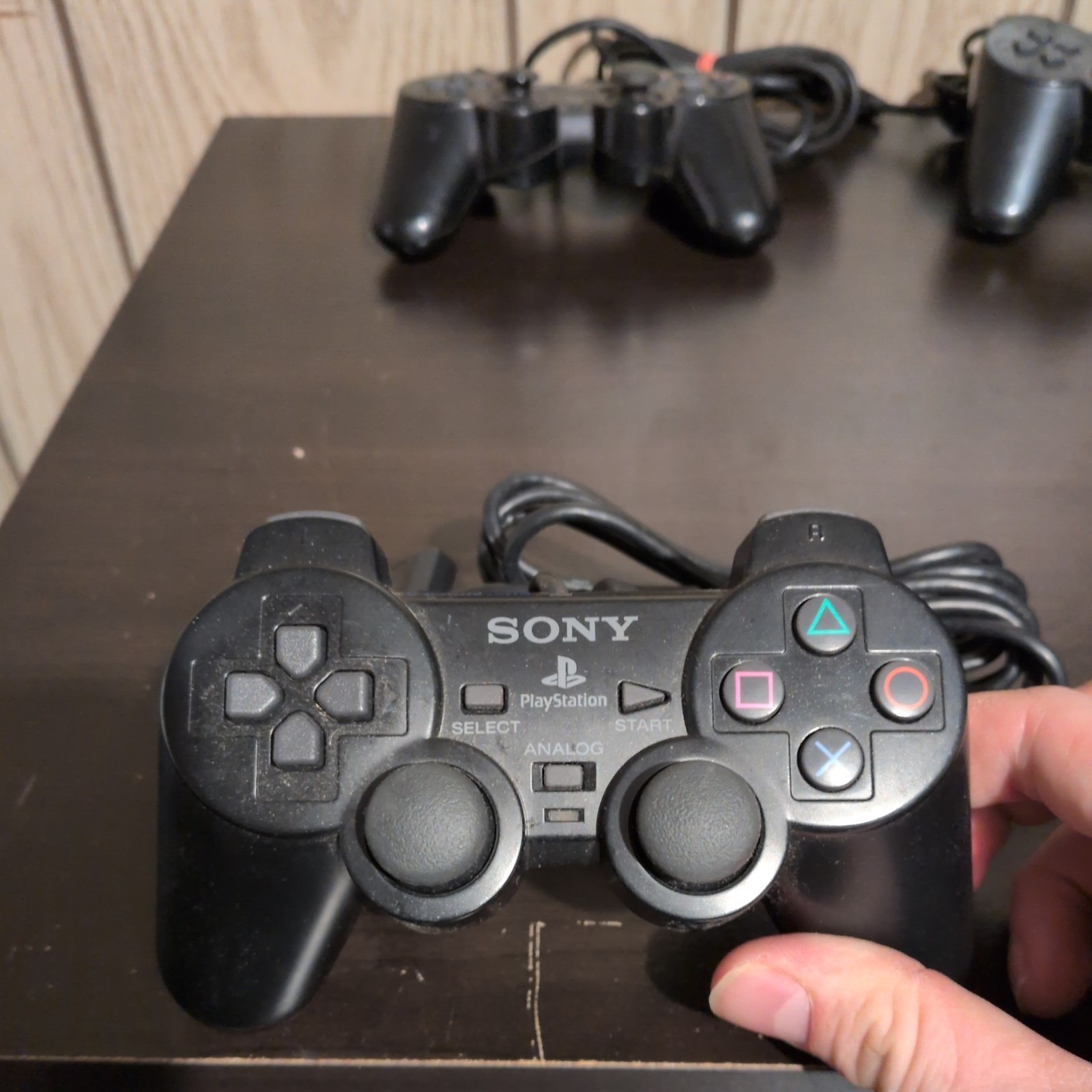 2 Sony PlayStation Consoles (w/Controllers, Cable, & 2 8MB Memory Cards)