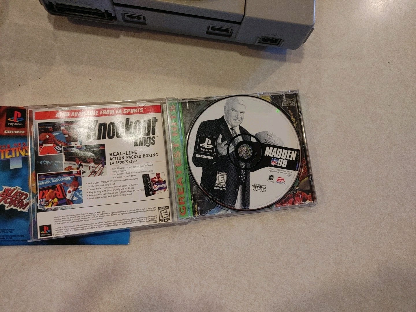 Sony PlayStation Console with two controllers and games